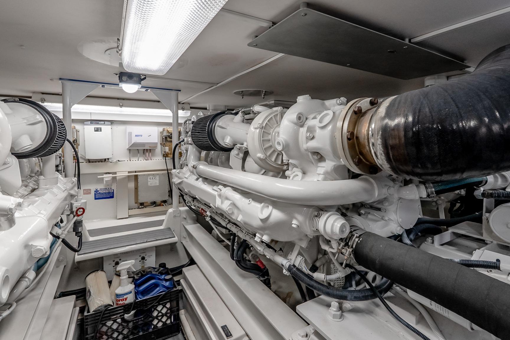 Engine room of a 2000 Viking 50' Convertible yacht, showcasing machinery and equipment.