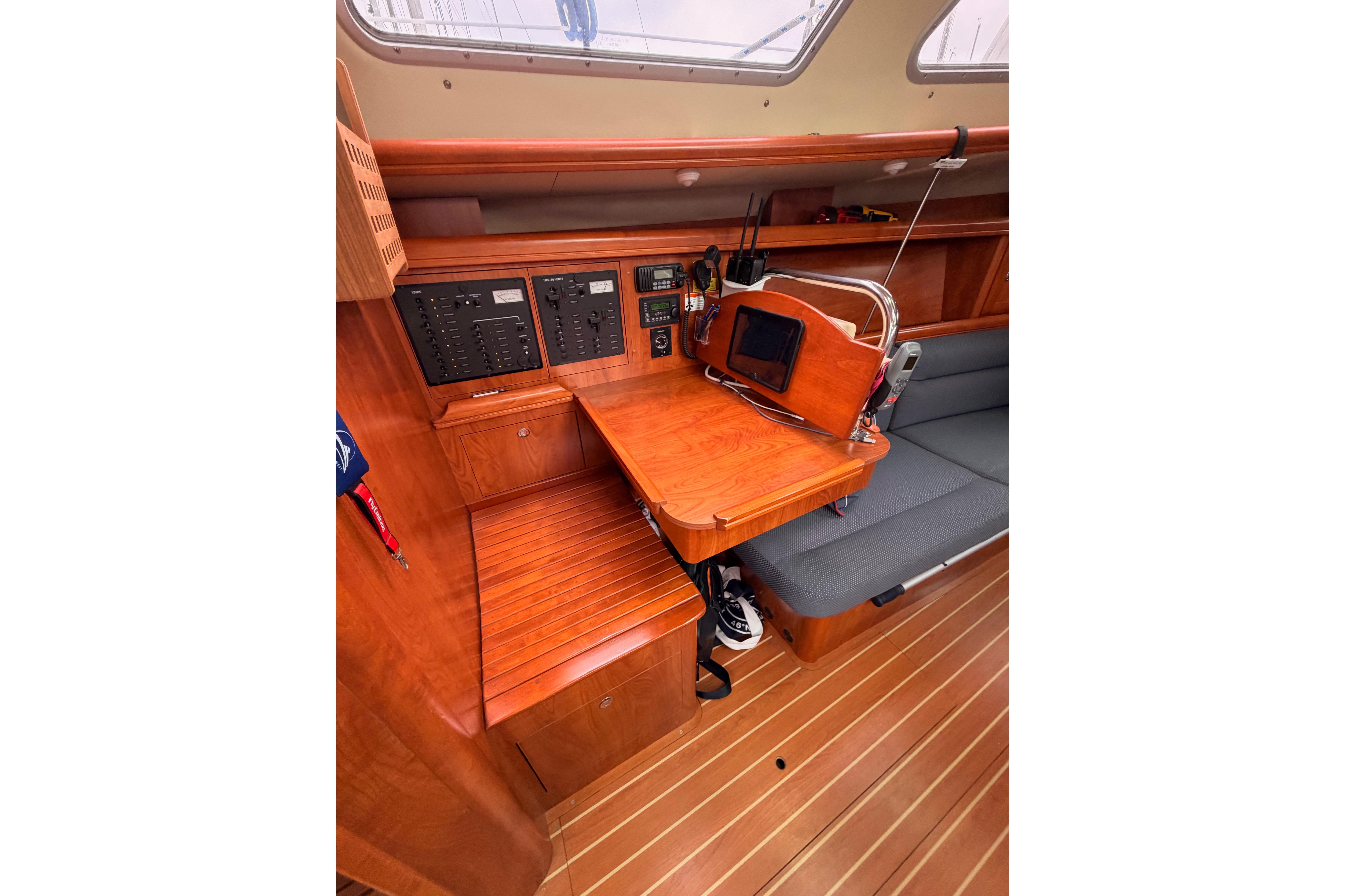 2009 Hunter 38 yacht interior with navigation station and wooden cabinetry.