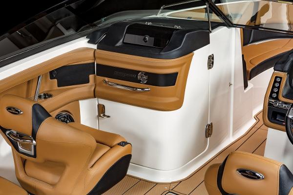 2024 Chaparral 28 Surf boat interior with tan leather seating and sleek design.