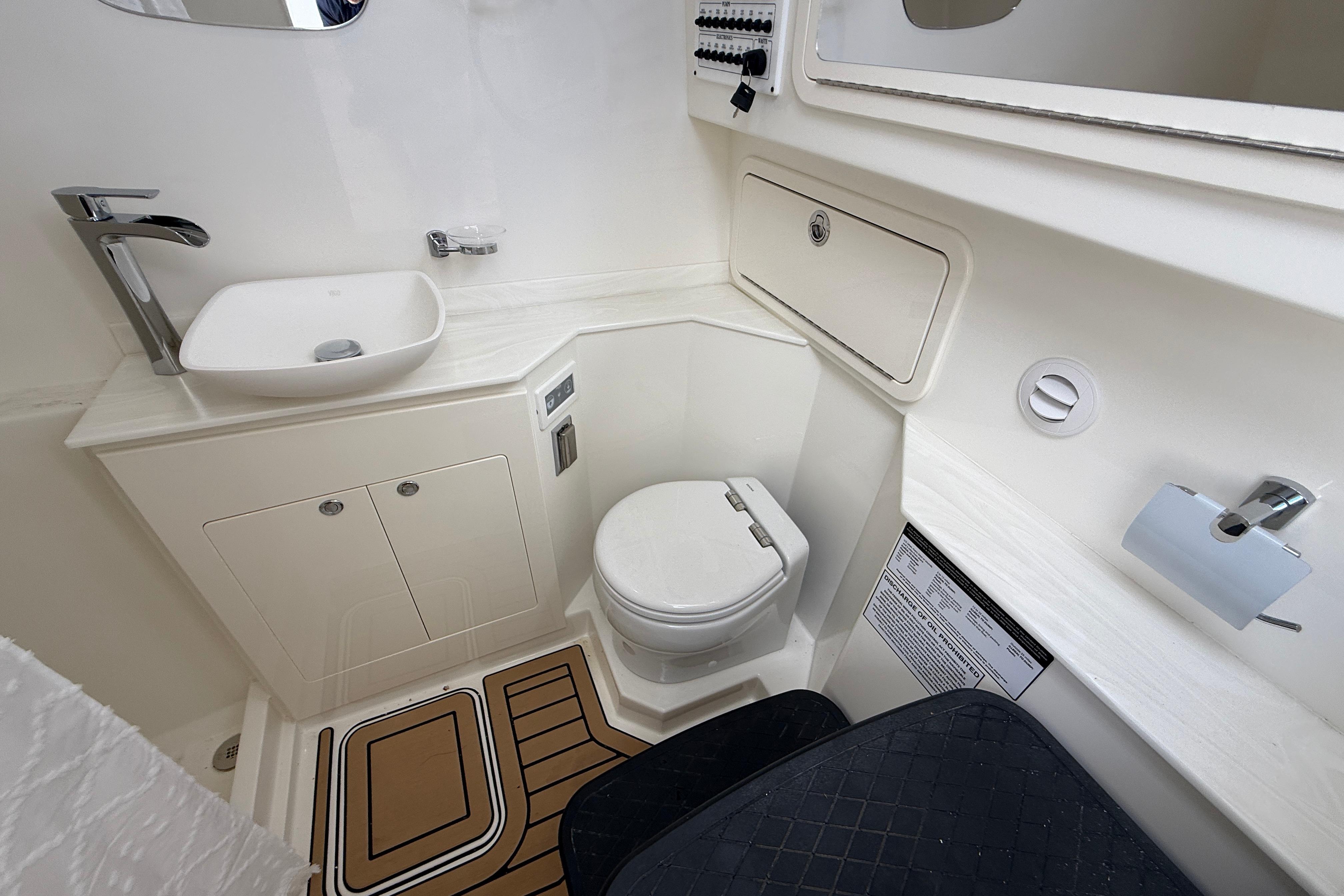 Luxurious bathroom in 2026 World Cat 400 DC-X Island boat, featuring modern fixtures and elegant design.