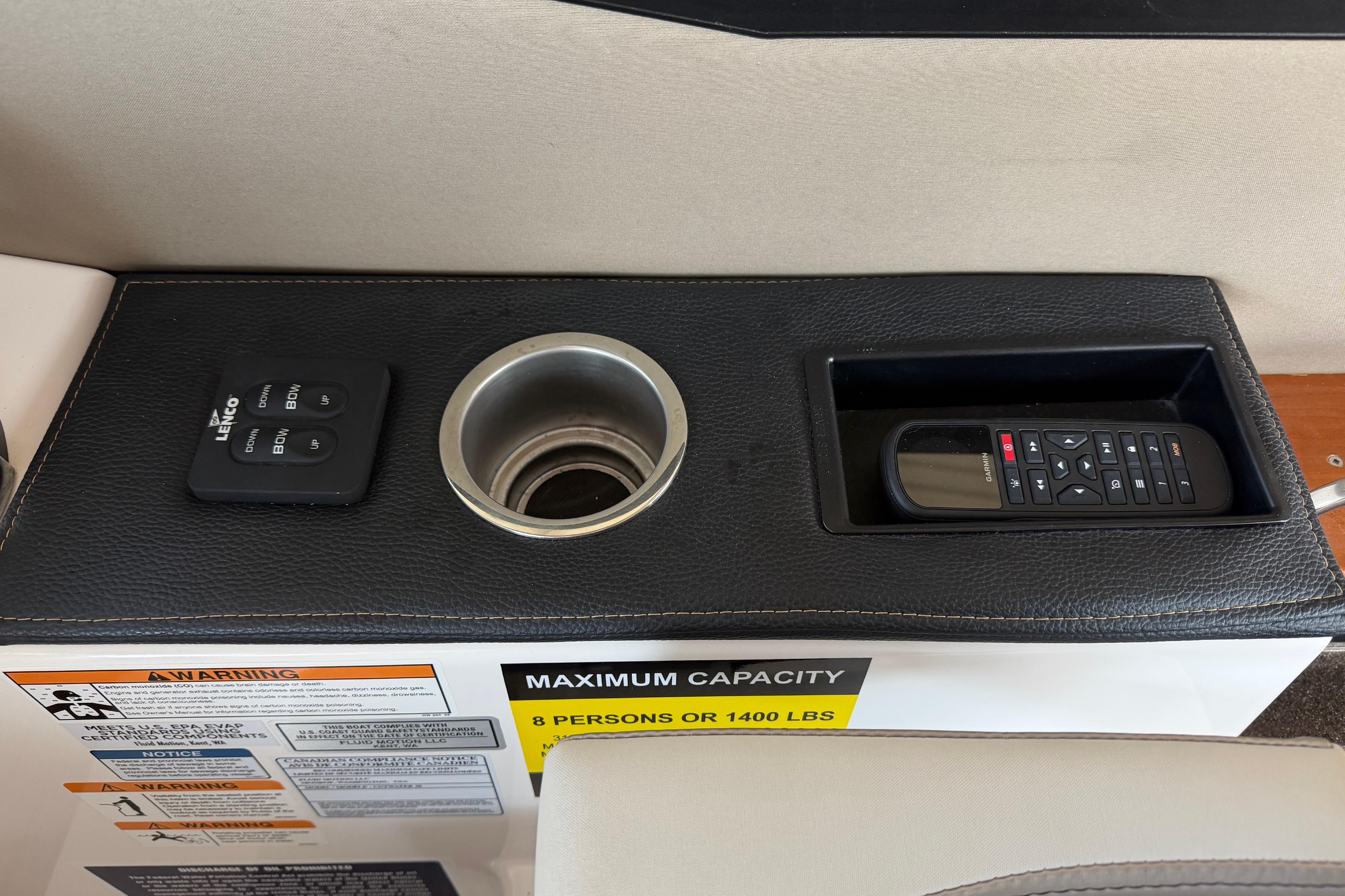 2023 Cutwater C-288 Coupe console with controls, cup holder, and remote storage.