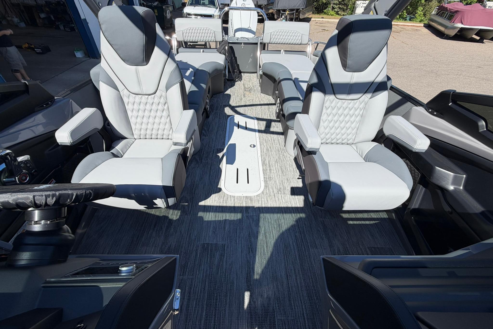 Luxurious interior of 2026 Avalon Excalibur LTD Quad Lounge boat with plush seating.