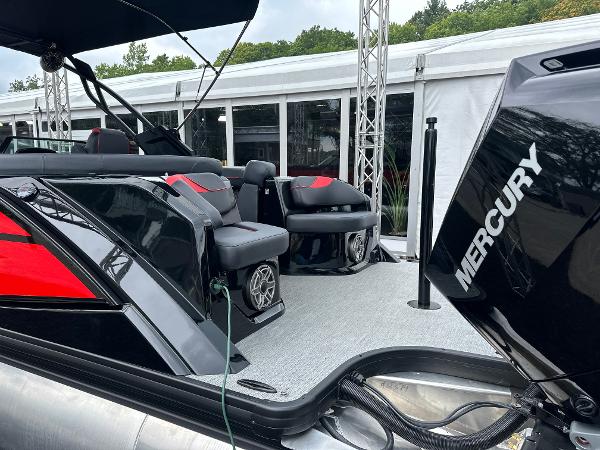 2024 Godfrey XP 27' boat with twin Mercury 400HP engines, sleek black and red design.