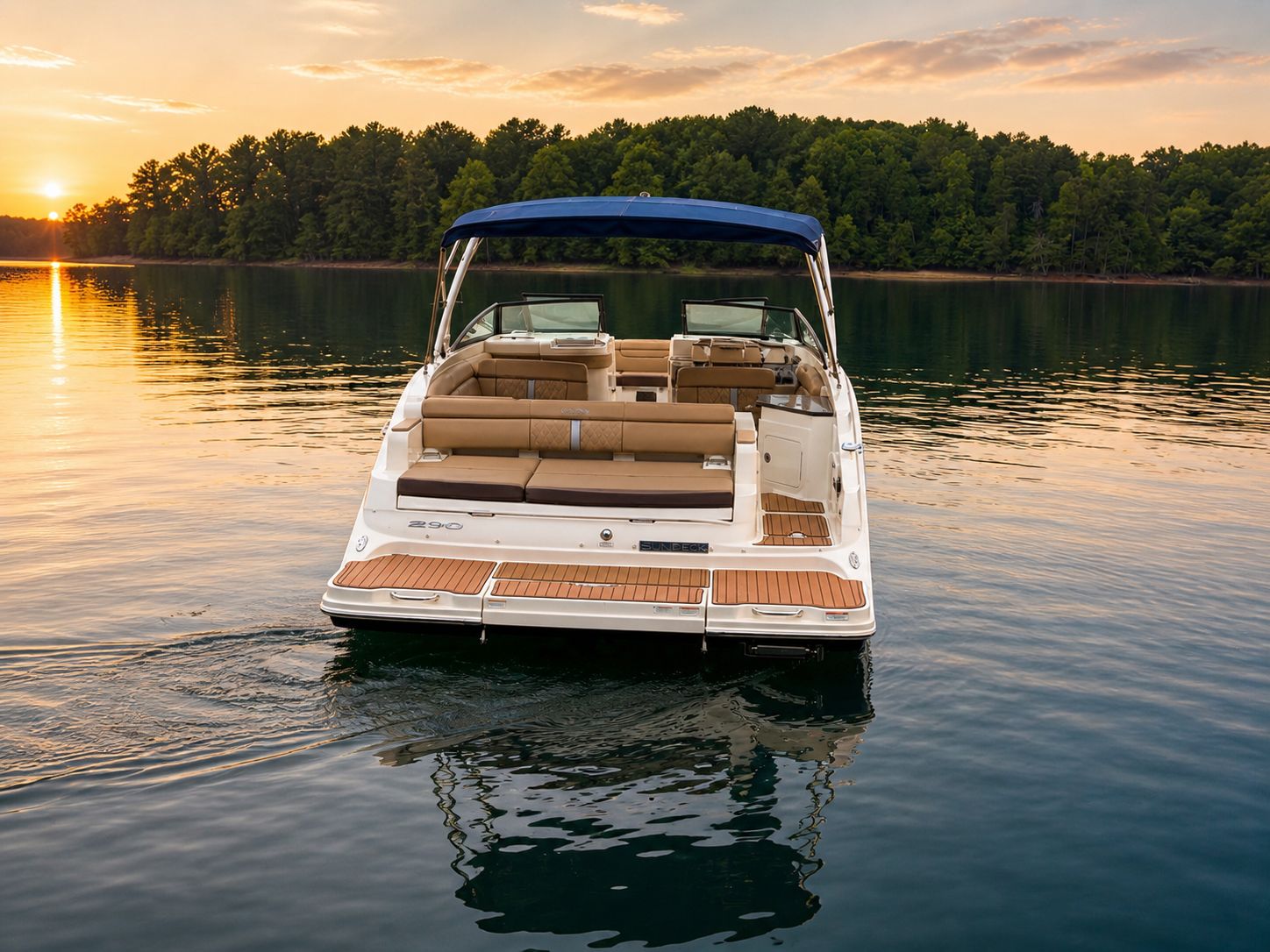 2016 Sea Ray 290 Sundeck on tranquil lake at sunset.