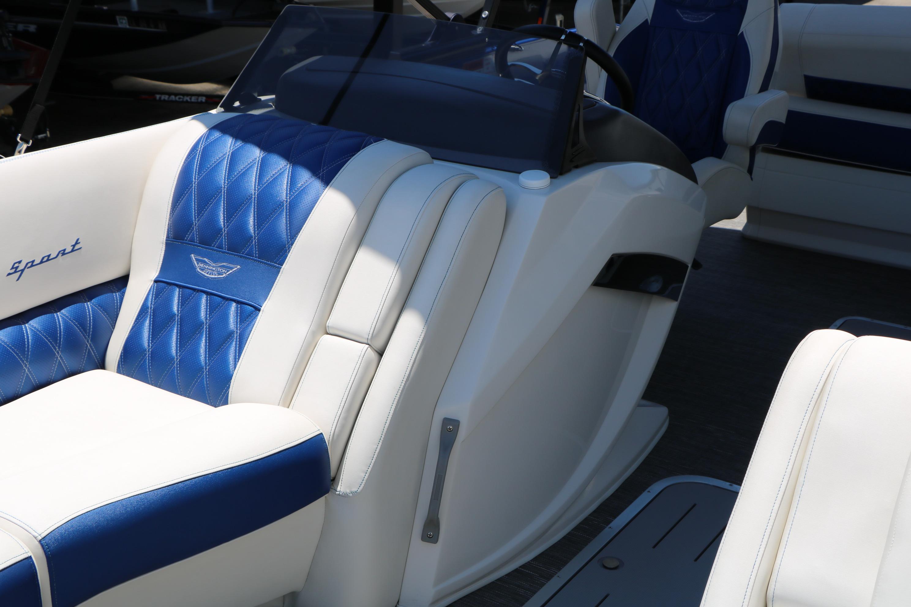 2024 Bennington 23 RX Swingback boat interior with blue and white seating.