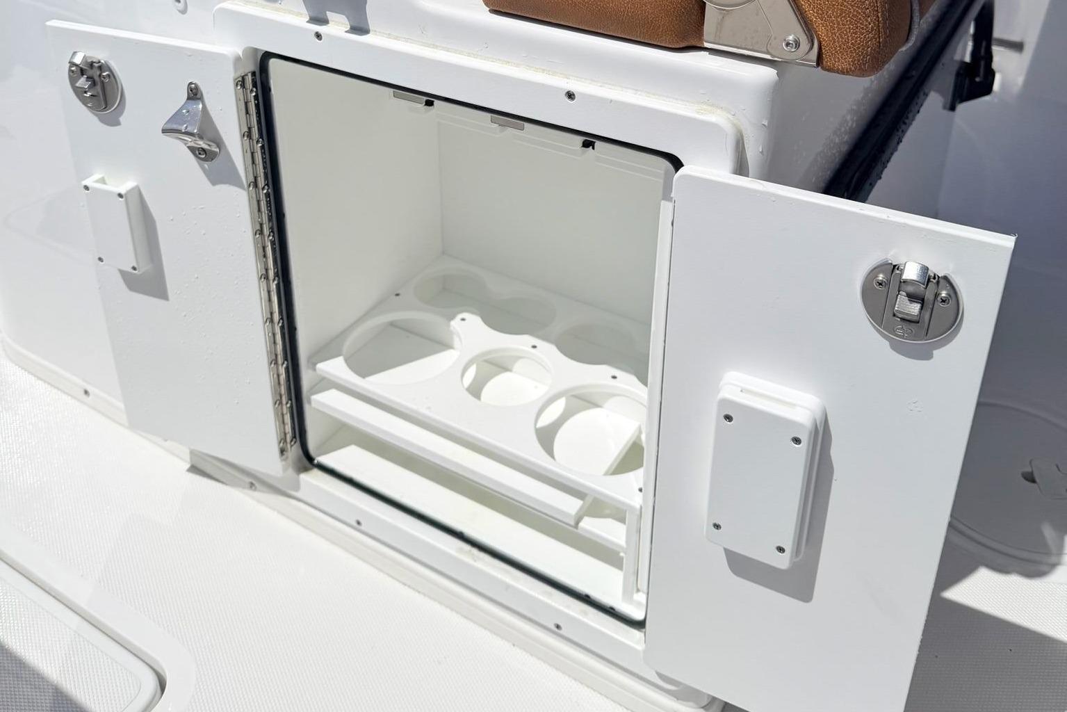 Open storage compartment in Sea Hunt Ultra 305 Coffin Box boat, 2026 model.