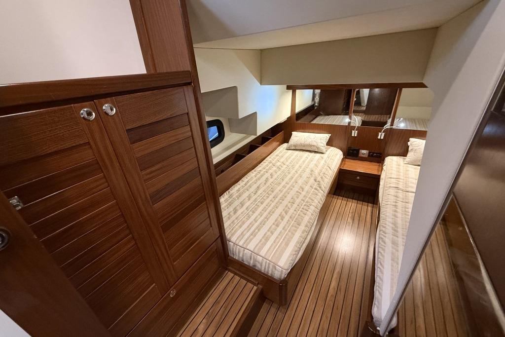 Cozy twin cabin with wooden interior in 2012 Sasga Yachts Menorquin 42.