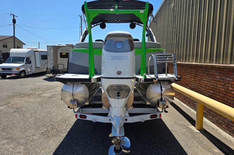 2026 Berkshire STS Arch Performance Series boat with Suzuki 350 outboard motor, parked outdoors.
