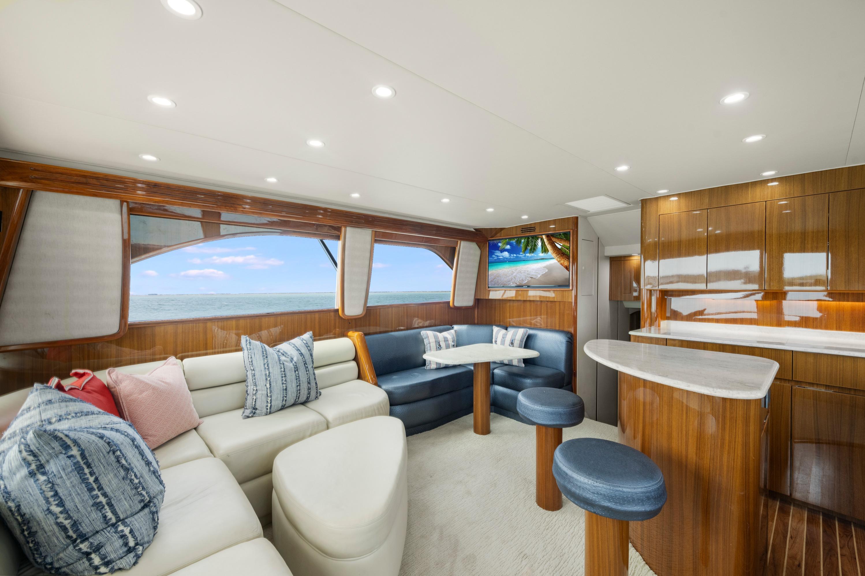 Luxurious interior of 2009 Viking 50 Convertible yacht with elegant seating and ocean view.
