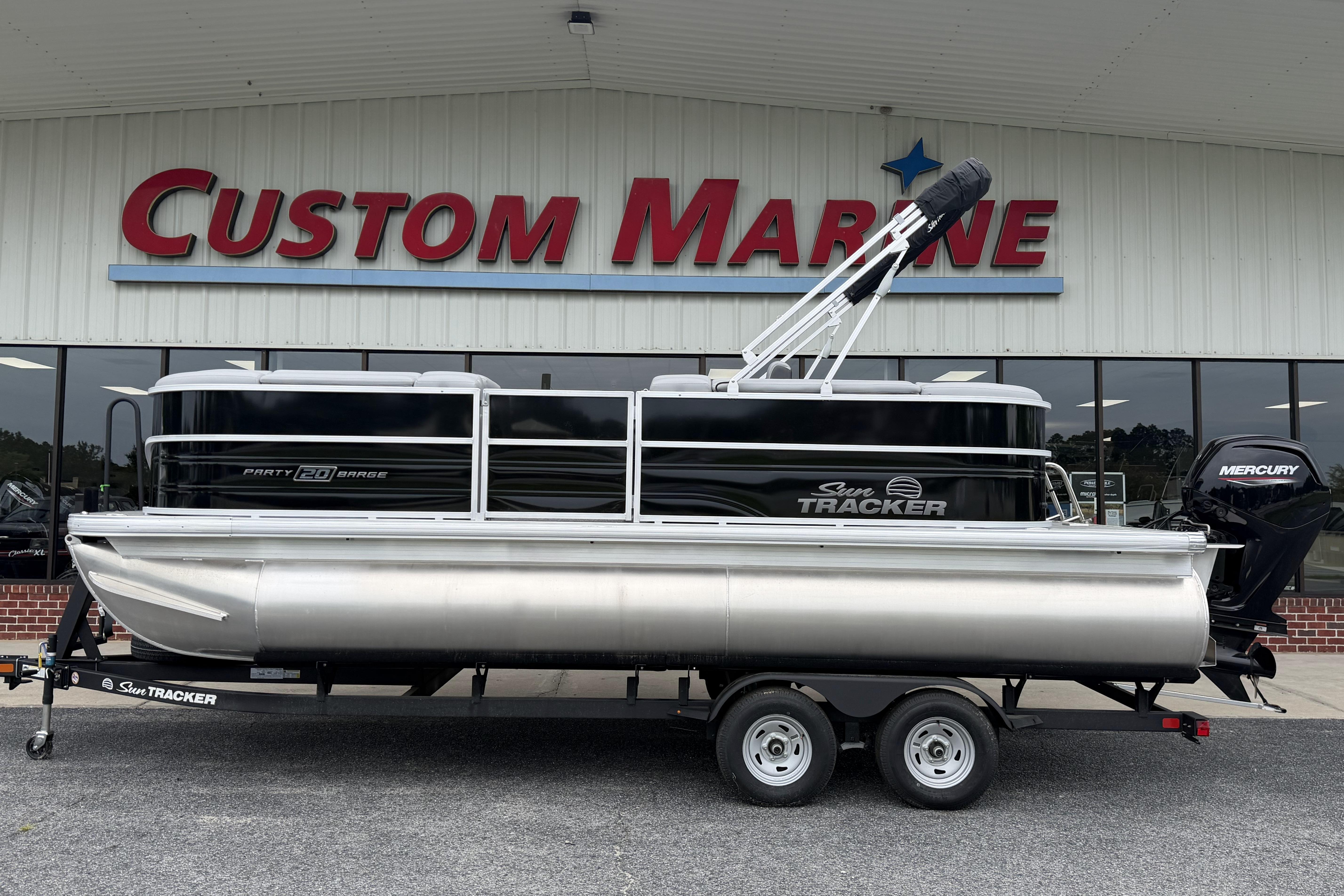 2026 Sun Tracker Party Barge 20 DLX pontoon boat at Custom Marine dealership.