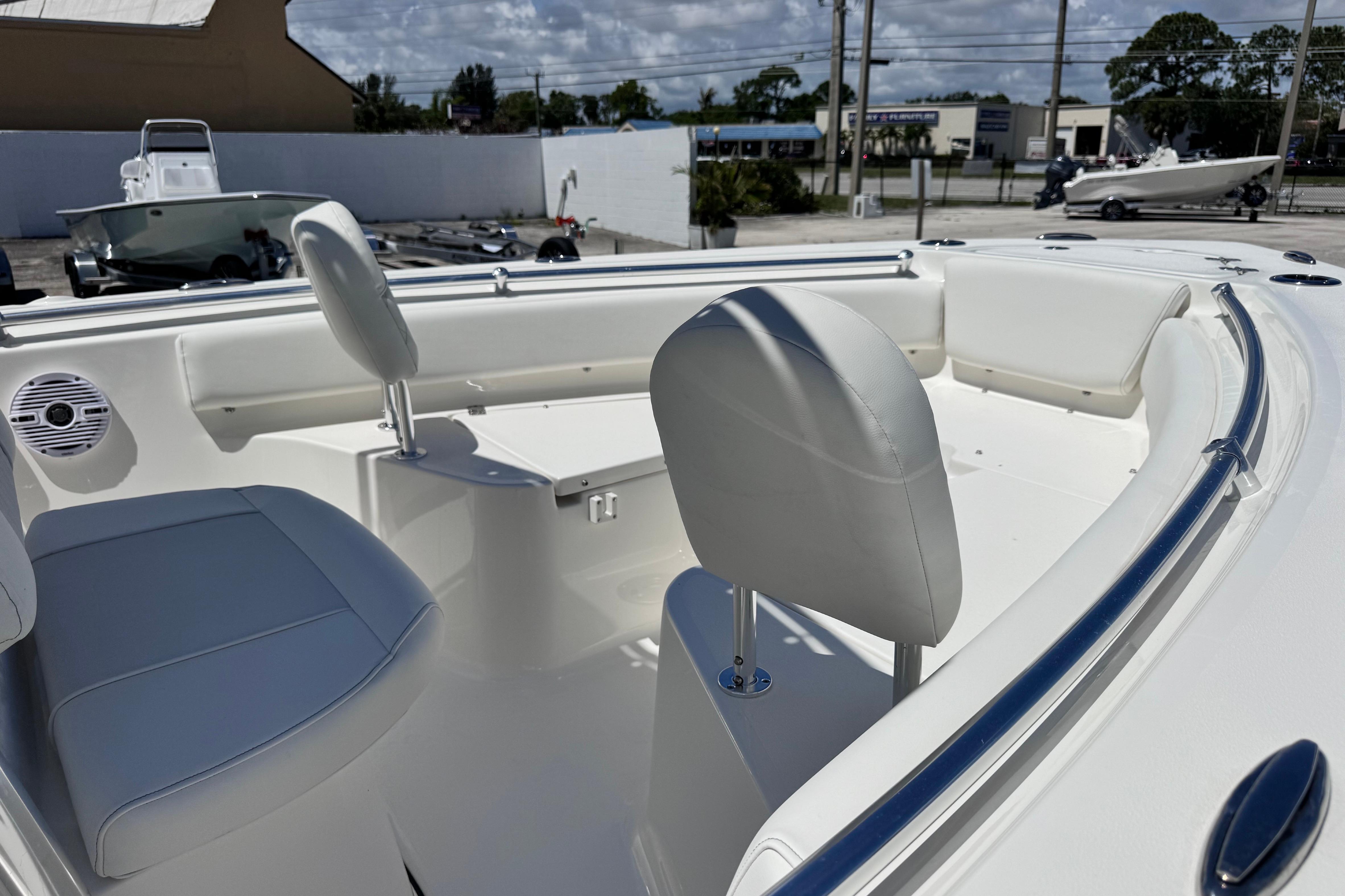 2026 Key West 219 FS boat interior with white seating and sleek design.
