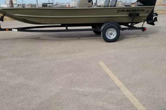 2026 Tracker Grizzly 1754 SC boat on trailer in parking lot.