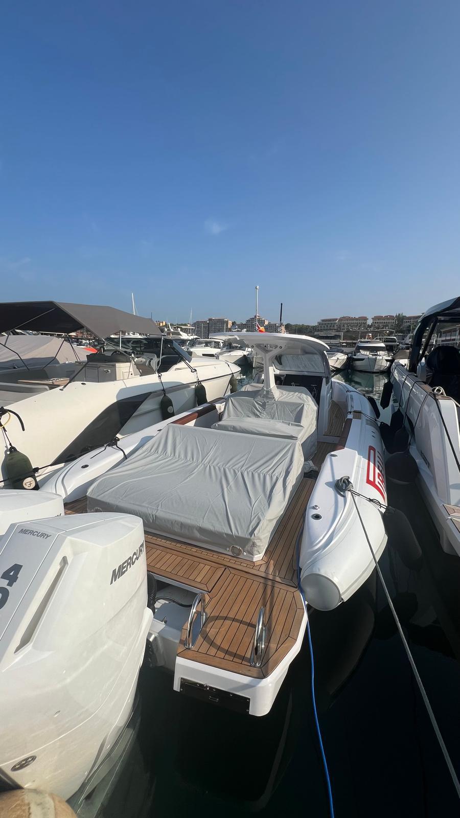 2024 Pirelli 35 boat docked in marina, featuring sleek design and modern amenities.