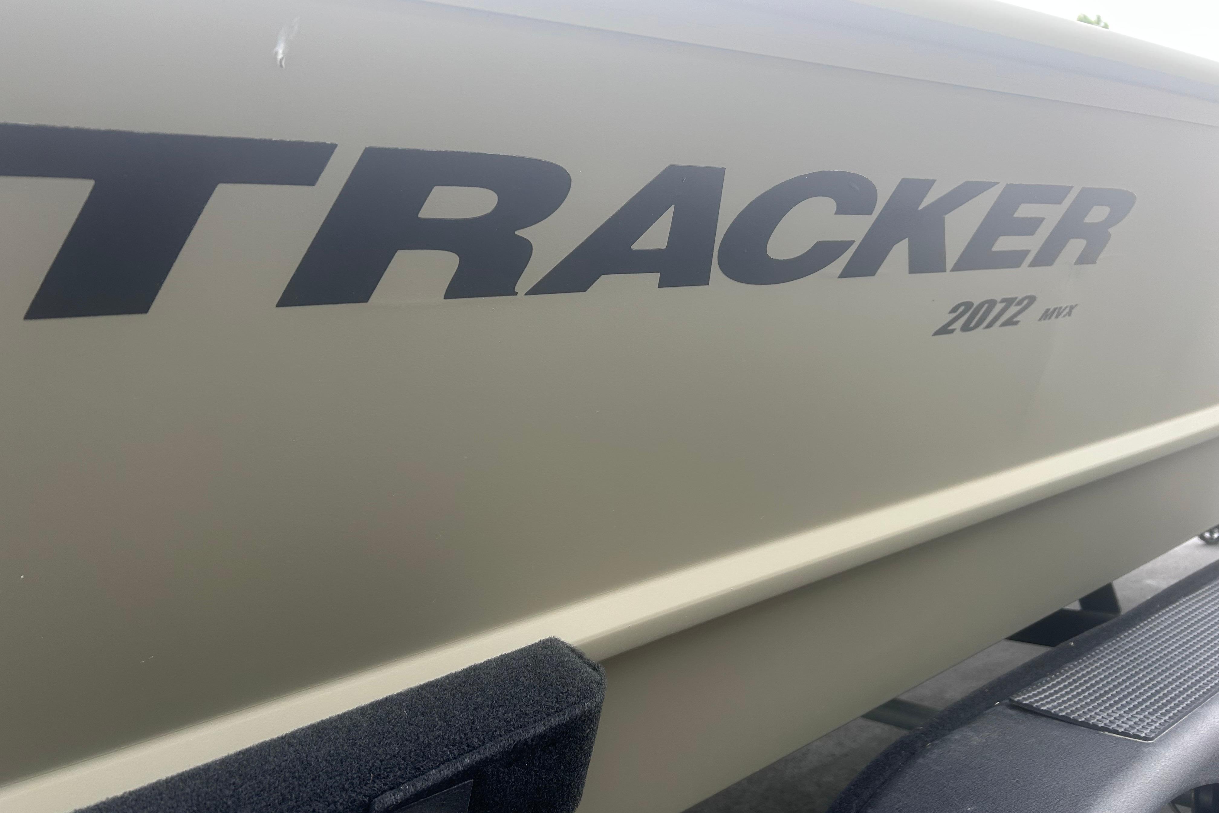 2024 Tracker Grizzly 2072 CC boat side view with logo and model details.