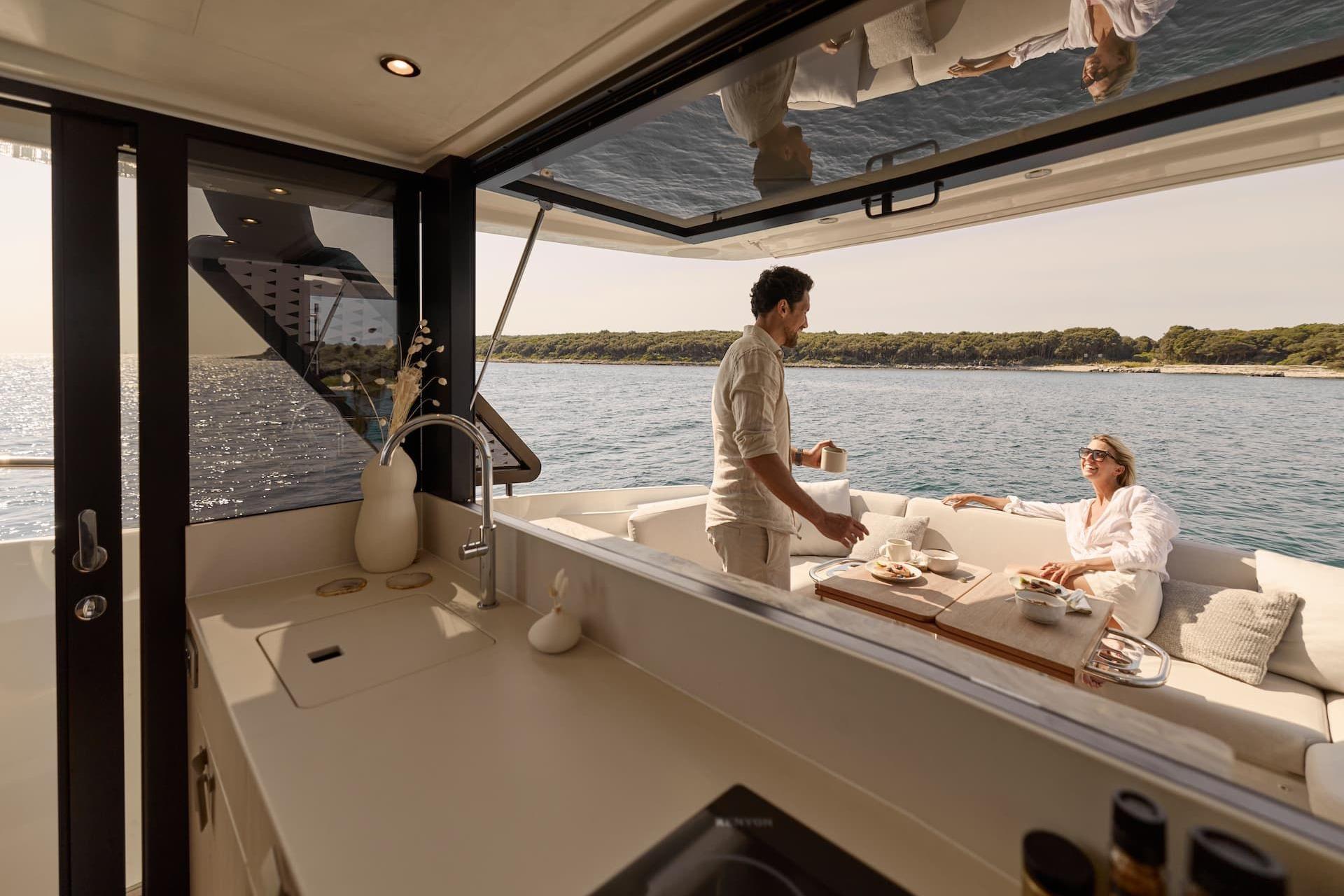 Manufacturer Provided Image: Couple enjoying breakfast on a Prestige F4.3 yacht, 2026 model, with ocean view.