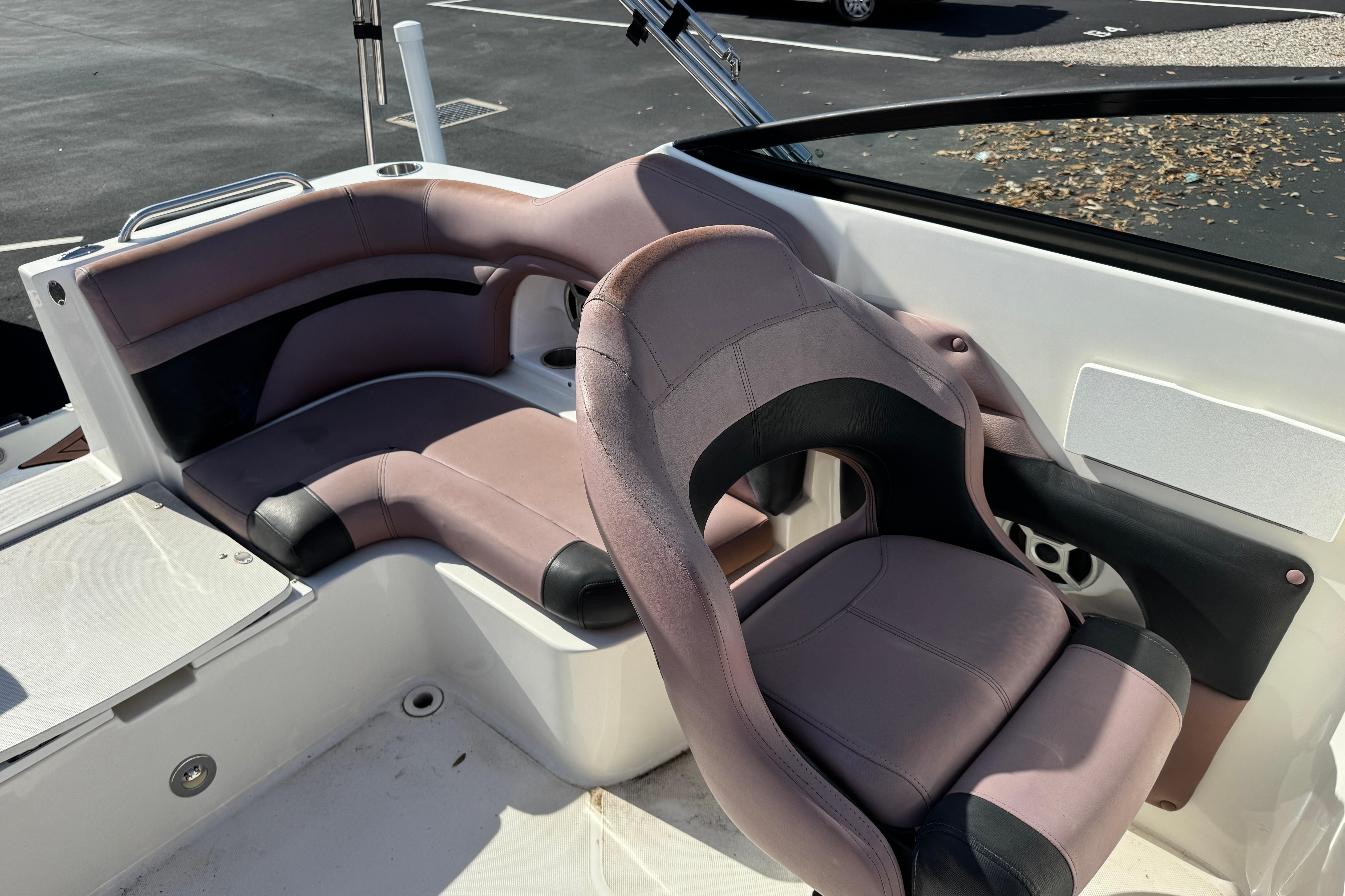 2018 Hurricane SunDeck 2400 OB boat interior with plush seating and modern design.
