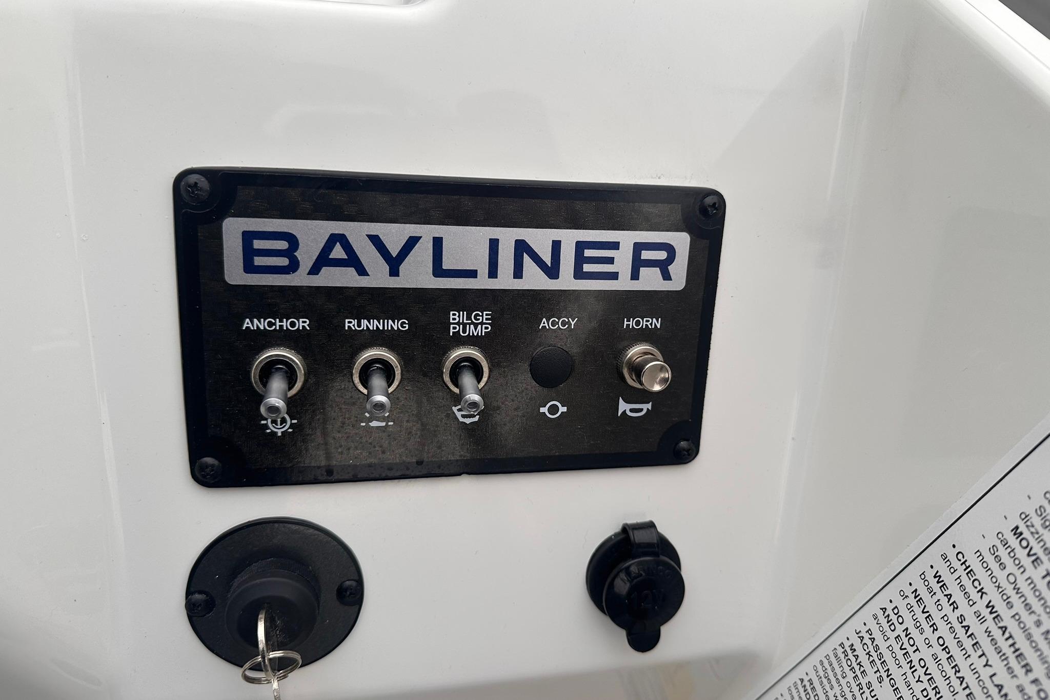 Control panel of 2026 Bayliner M17 boat with switches for anchor, running, bilge pump, and horn.