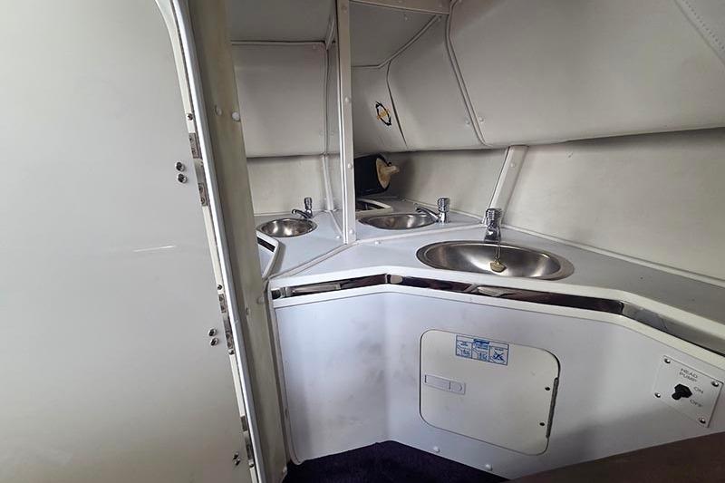 2004 Fountain 38 Lightning boat interior with dual sinks and storage compartments.