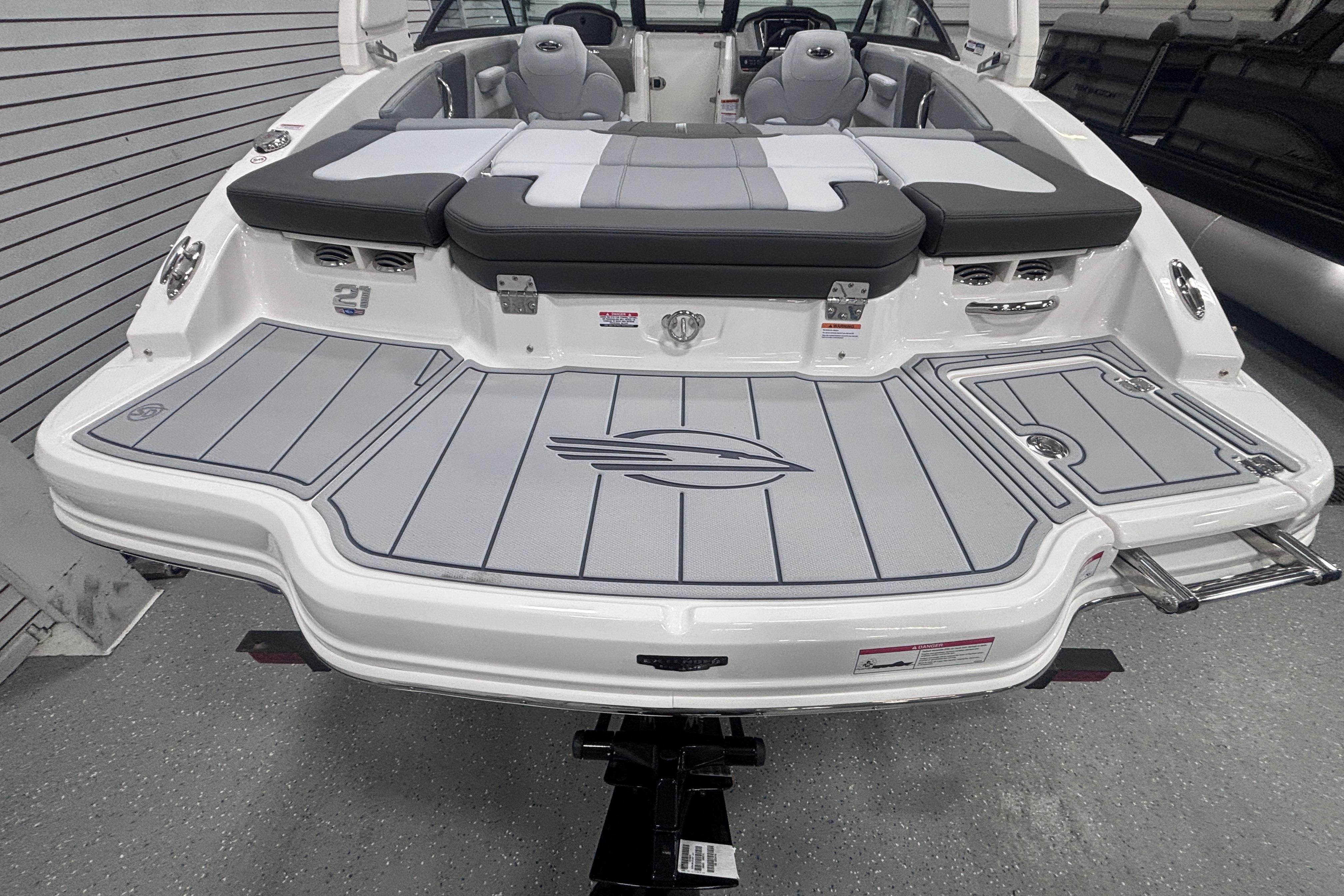 2026 Chaparral 21 SSi boat with sleek gray deck and comfortable seating.