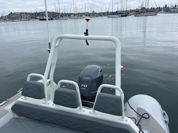 Highfield OM 500 boat with Yamaha 70 outboard motor in a marina, 2017 model.