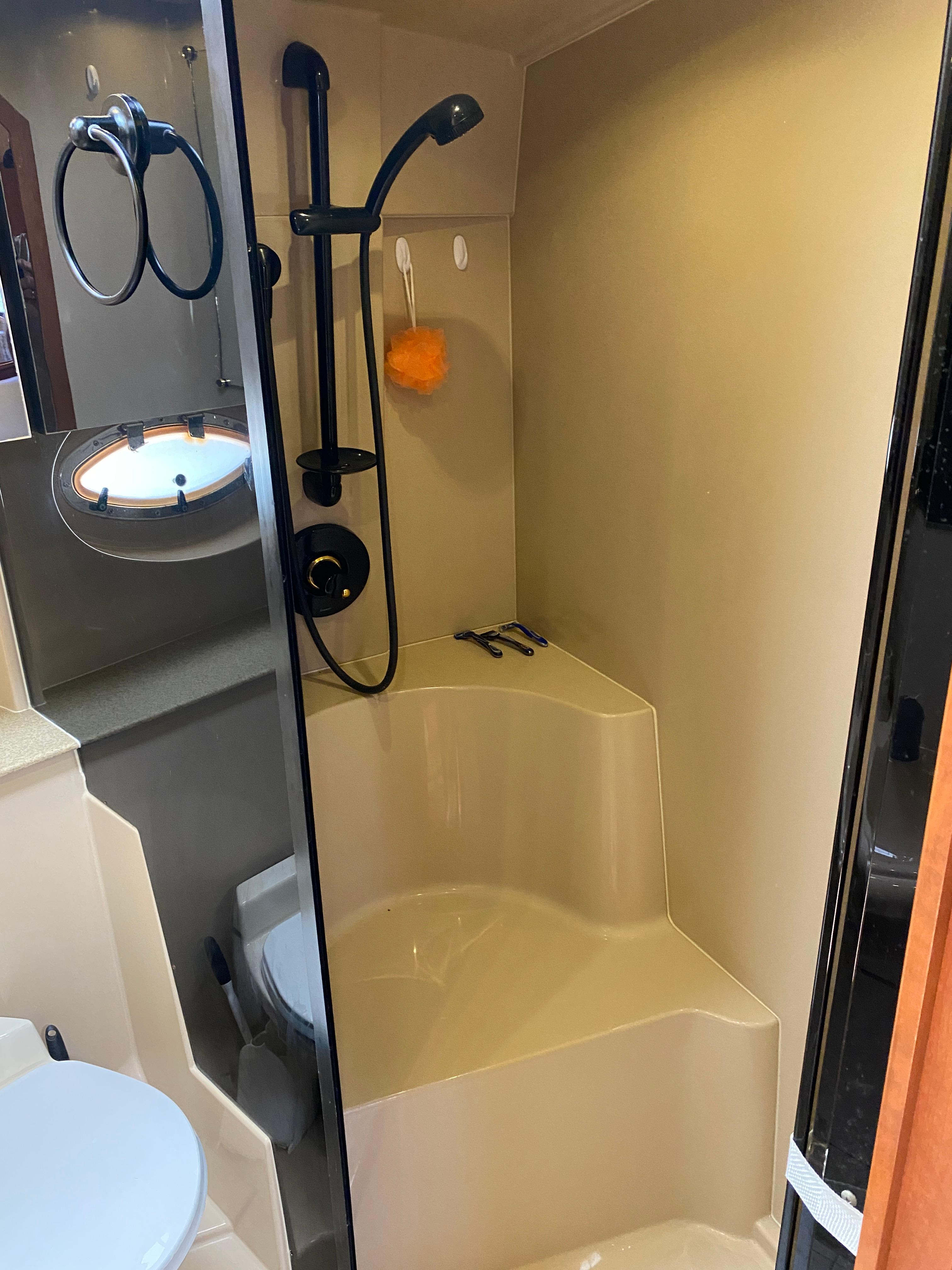 Bathroom interior of 2000 Cruisers 3672 yacht with shower and toilet.