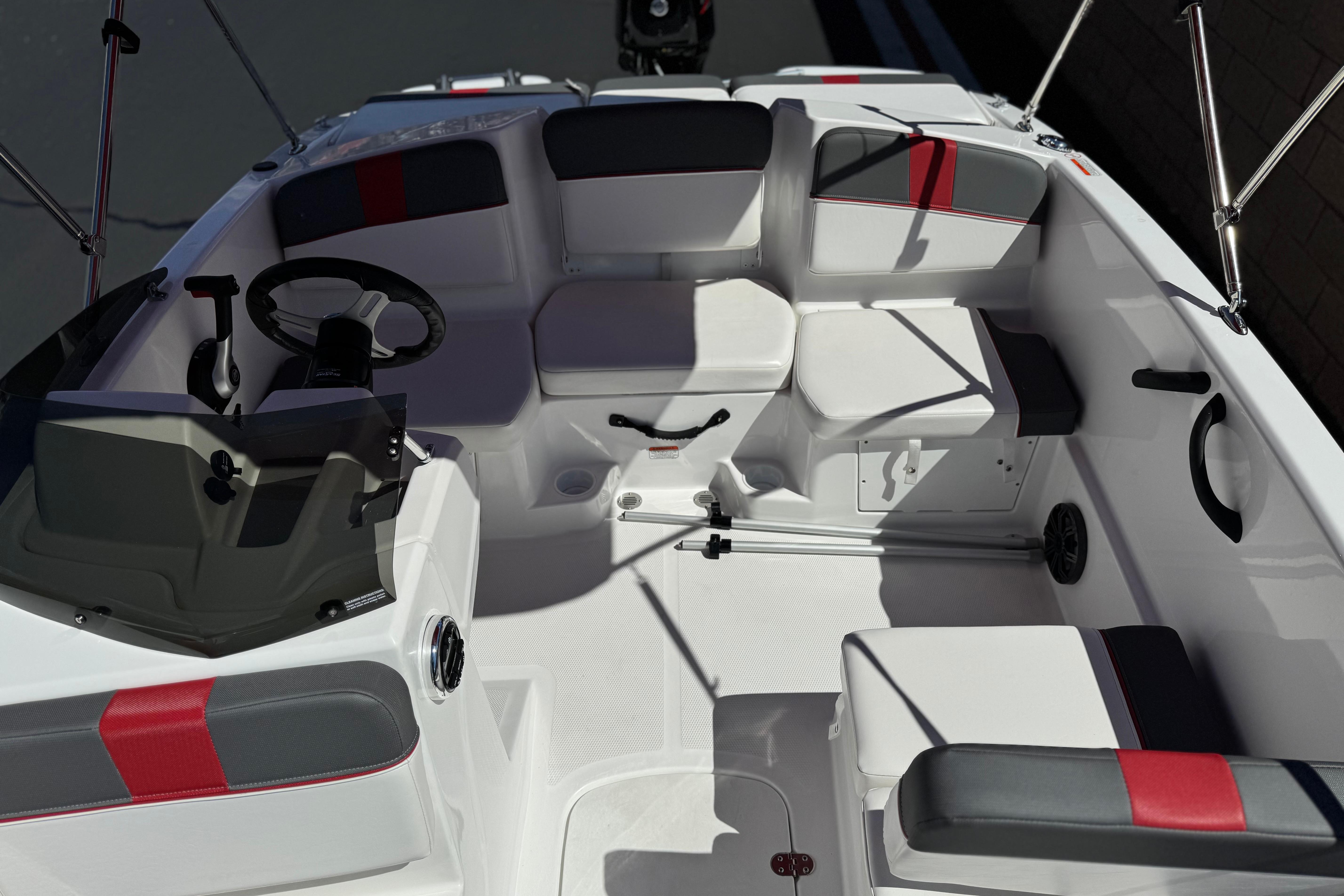 2024 Tahoe T16 boat interior with modern seating and steering wheel.