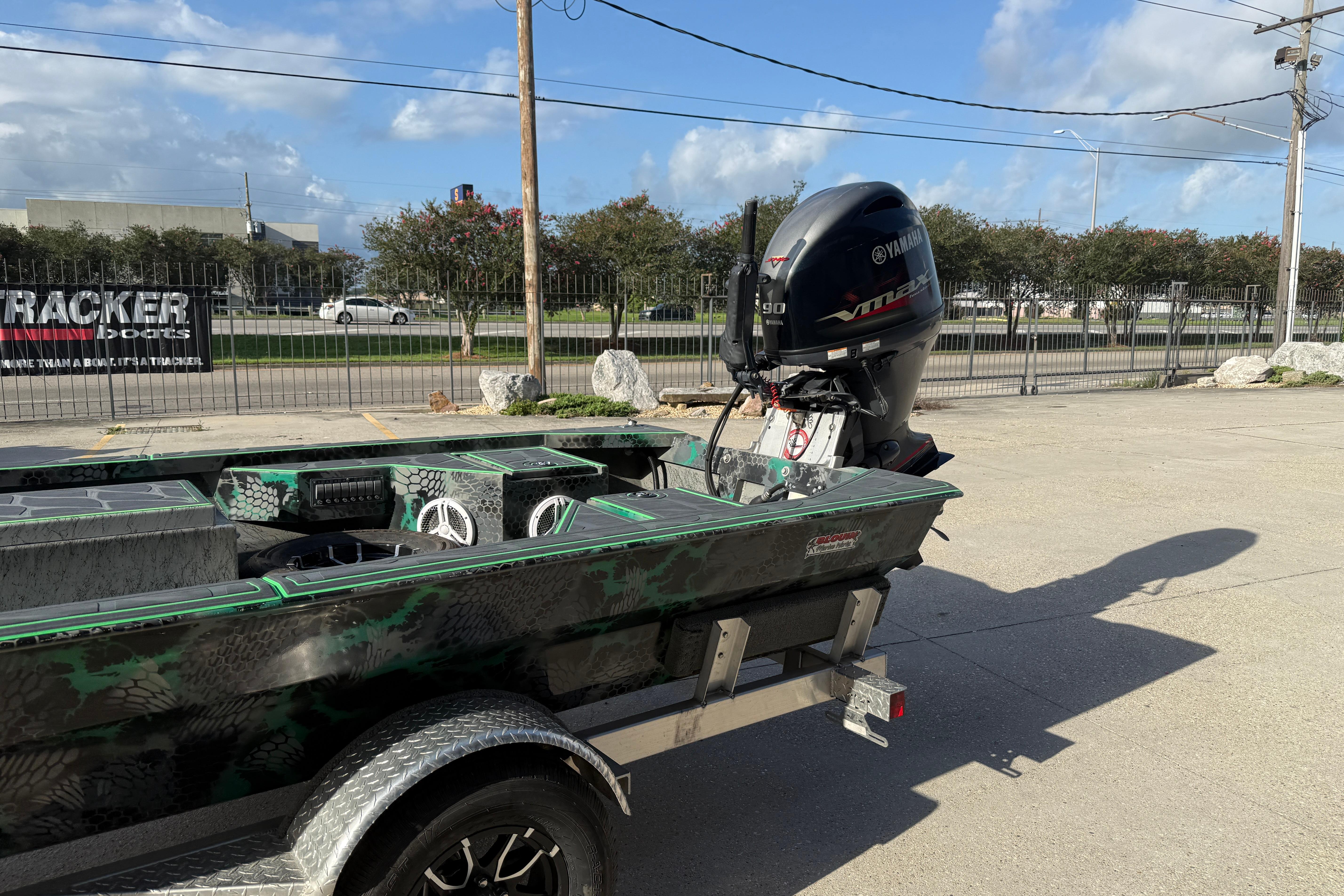 Custom Rene Gros 20x48 boat with Yamaha VMAX engine, parked outdoors, 2024 model.
