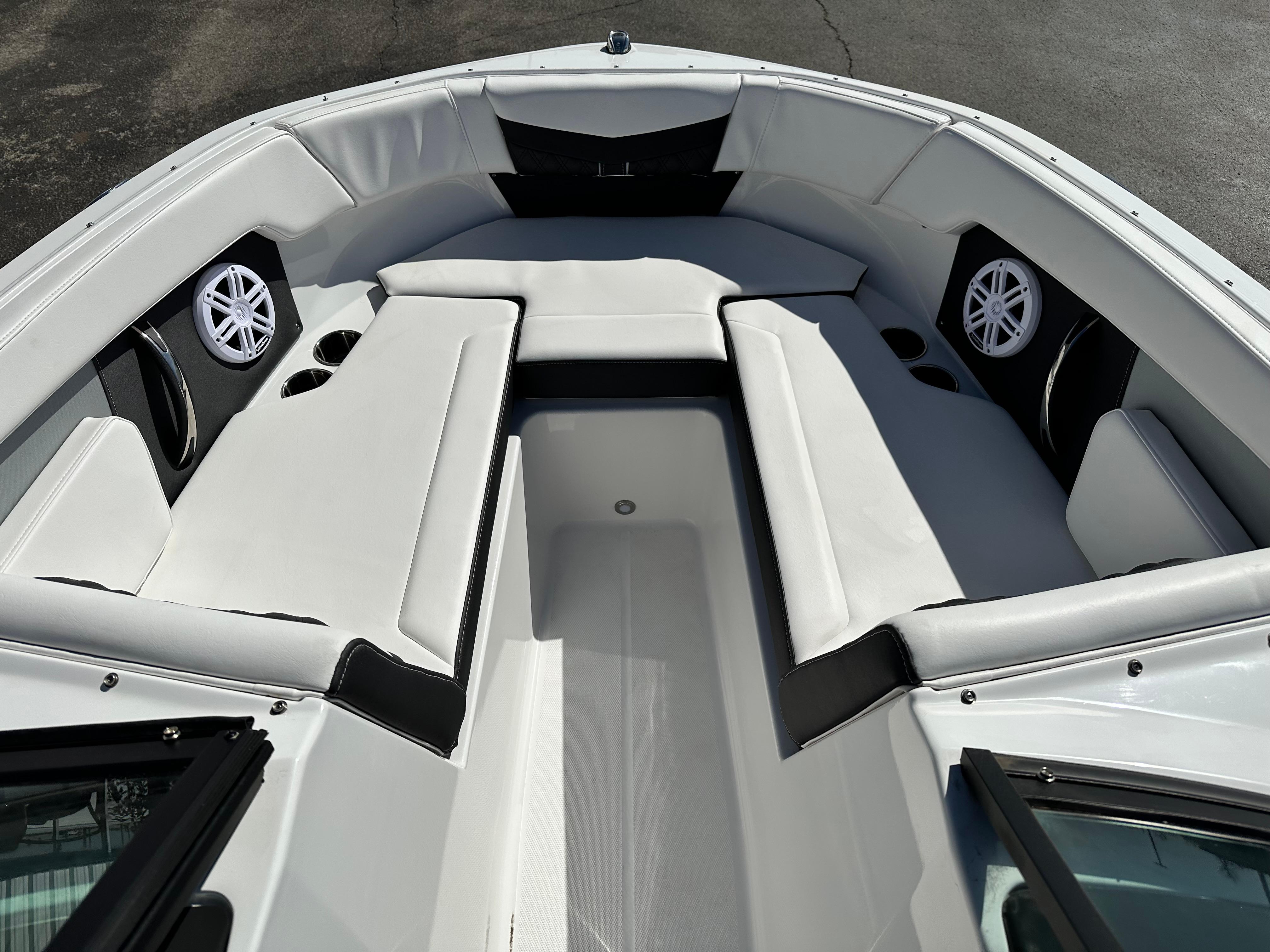 2025 Monterey M20 boat interior with white seating and built-in speakers.