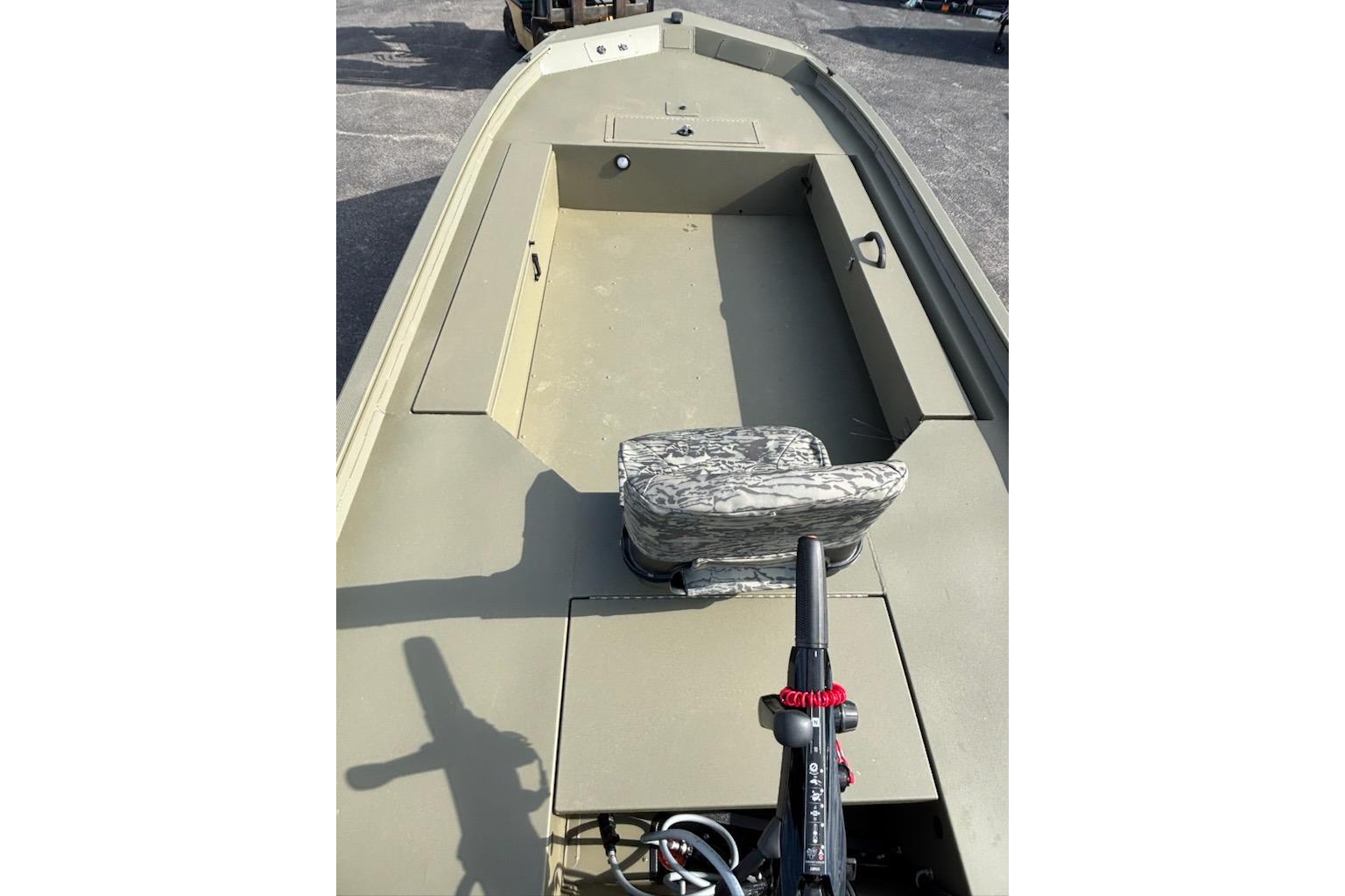 2026 Tracker Grizzly 1654 T Sportsman boat interior with camo seat and trolling motor.