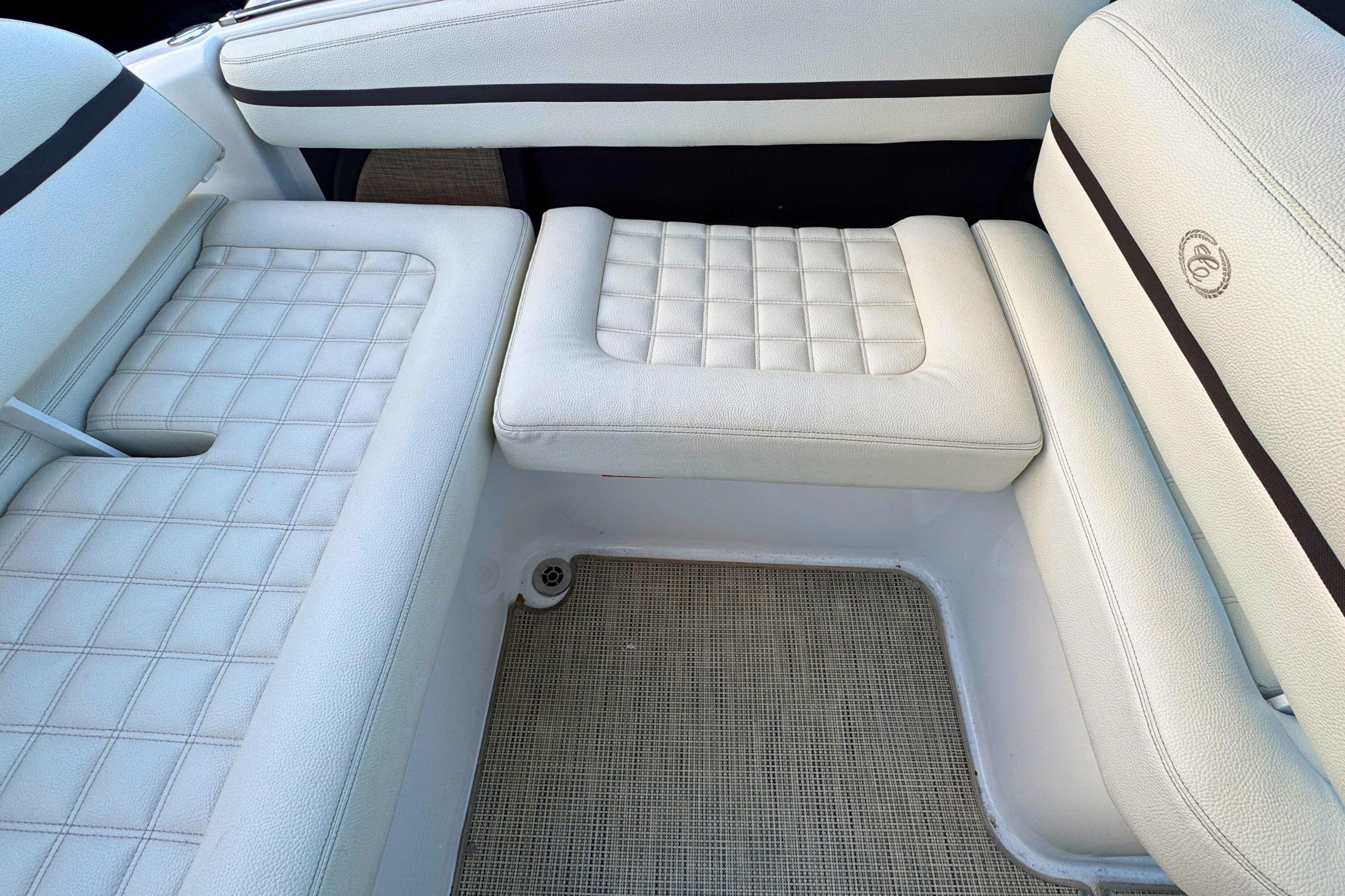 White leather seating in a 2019 Cobalt R3 boat interior.