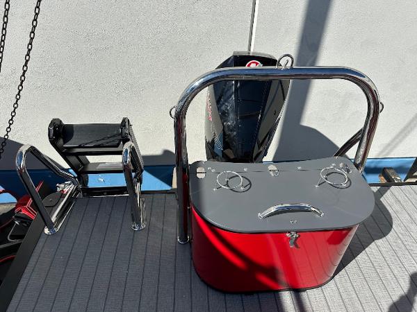 2025 Tahoe Pontoon 2585 LTZ Entertainer boat deck with motor and railing.