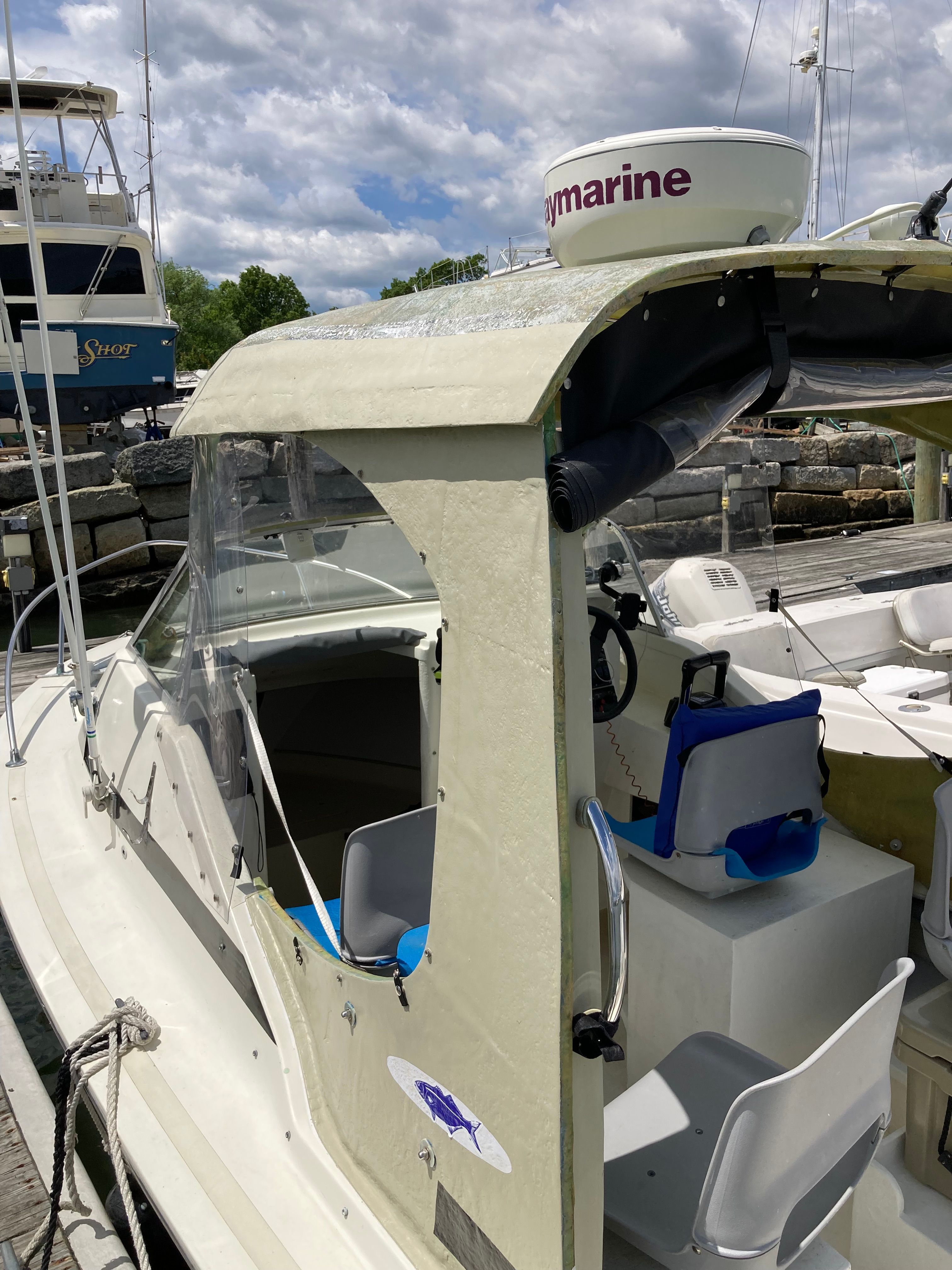 A 1969 Bertram Bahia Mar boat with an open cockpit and Raymarine radar on the roof.