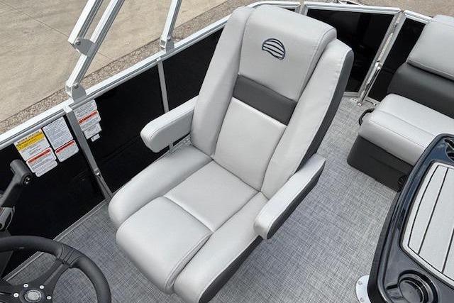 2026 Sun Tracker Party Barge 20 DLX captain's chair with sleek gray upholstery.
