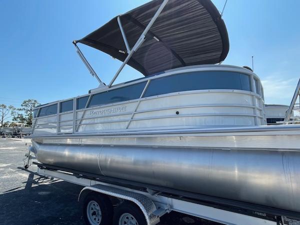 2025 Berkshire 22 RFX LE Tri-toon Pontoon on trailer, featuring sleek design and canopy.