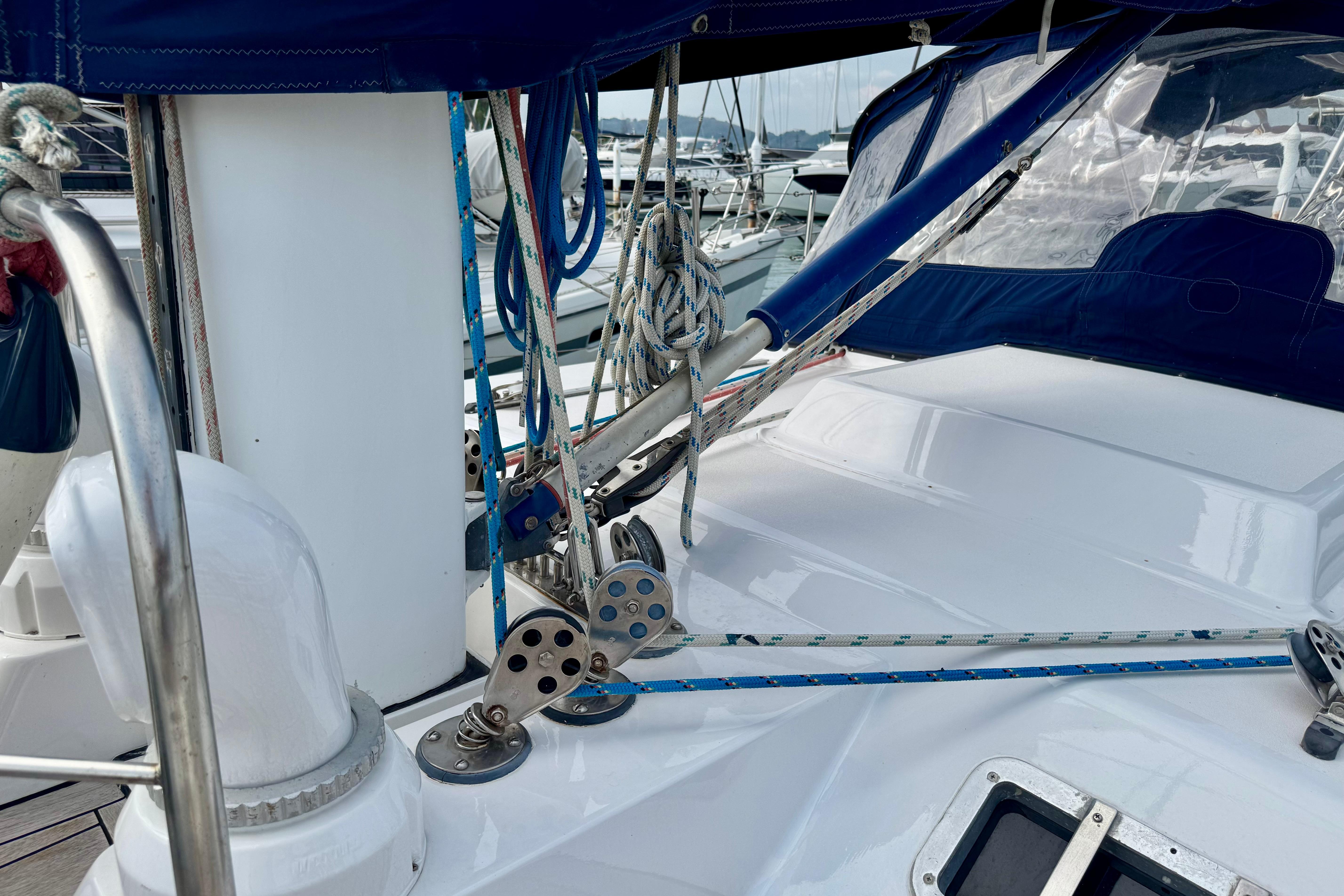 Deck view of a 1981 Ron Holland 52 sailboat with rigging and ropes.