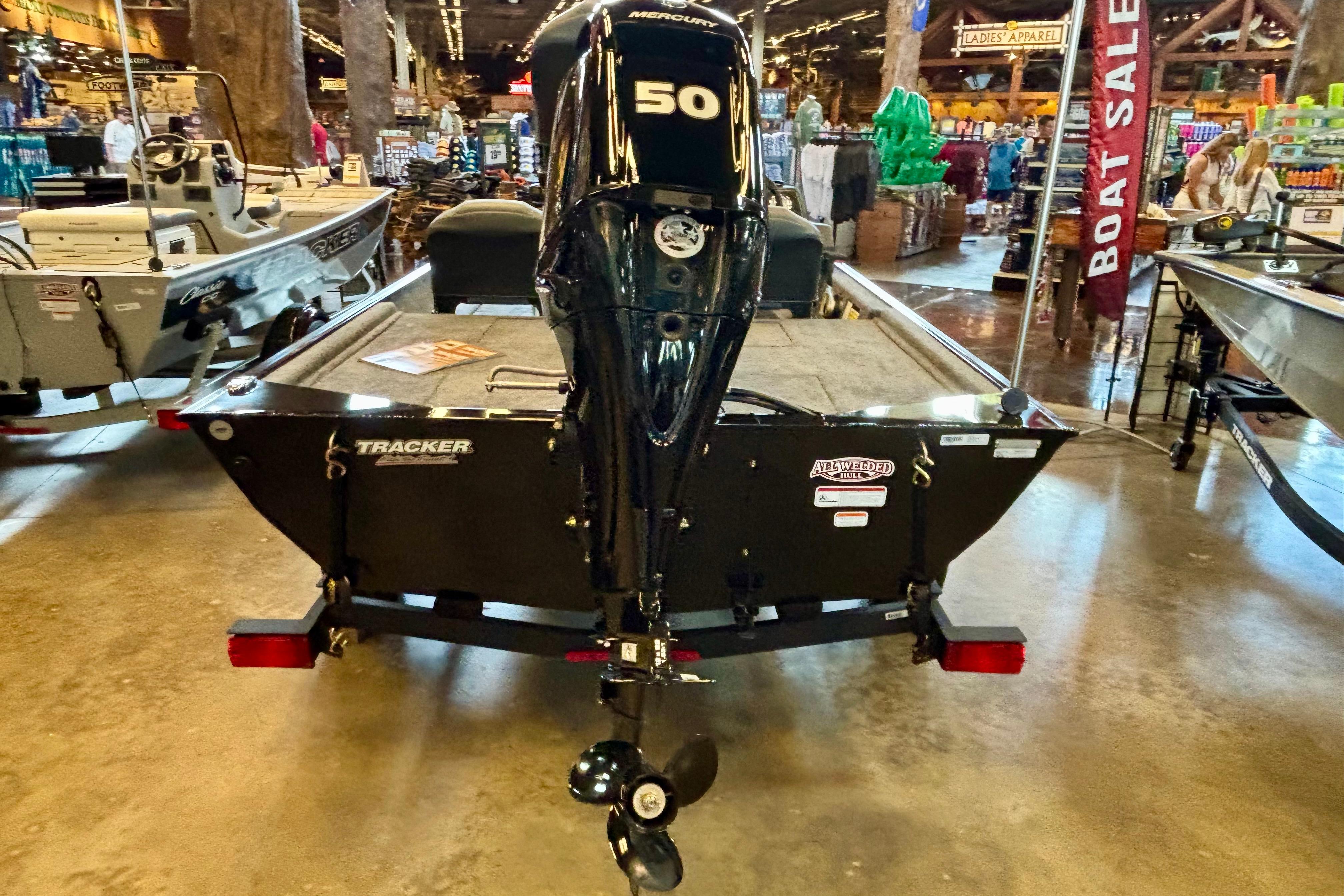 2026 Tracker Bass Tracker Classic XL boat with Mercury 50 engine displayed indoors.