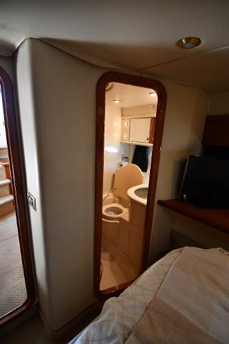 Interior view of 1997 Sunseeker Camargue 47 yacht cabin with bathroom.