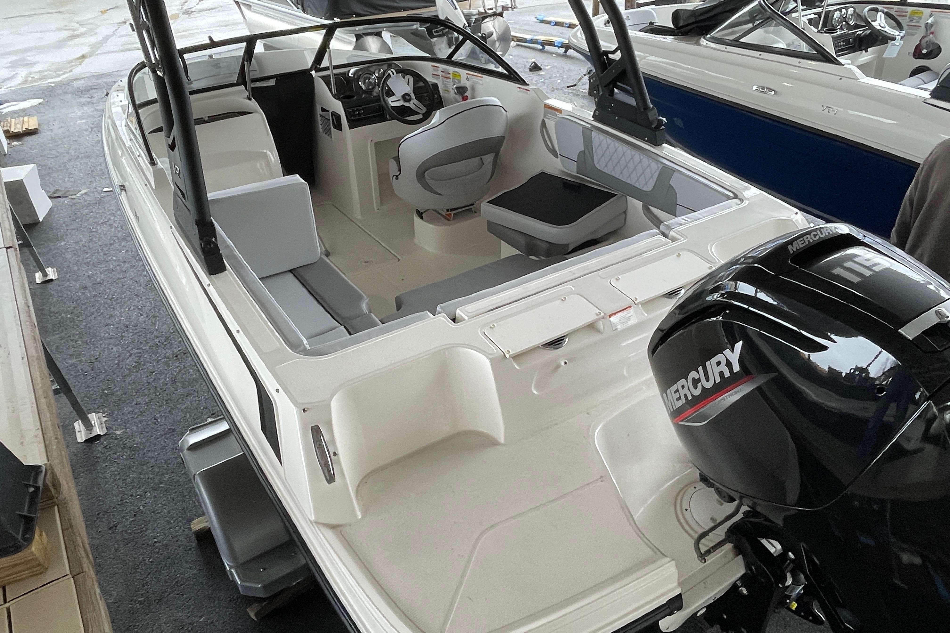 2026 Bayliner VR4 Bowrider OB with Mercury outboard engine, interior view.
