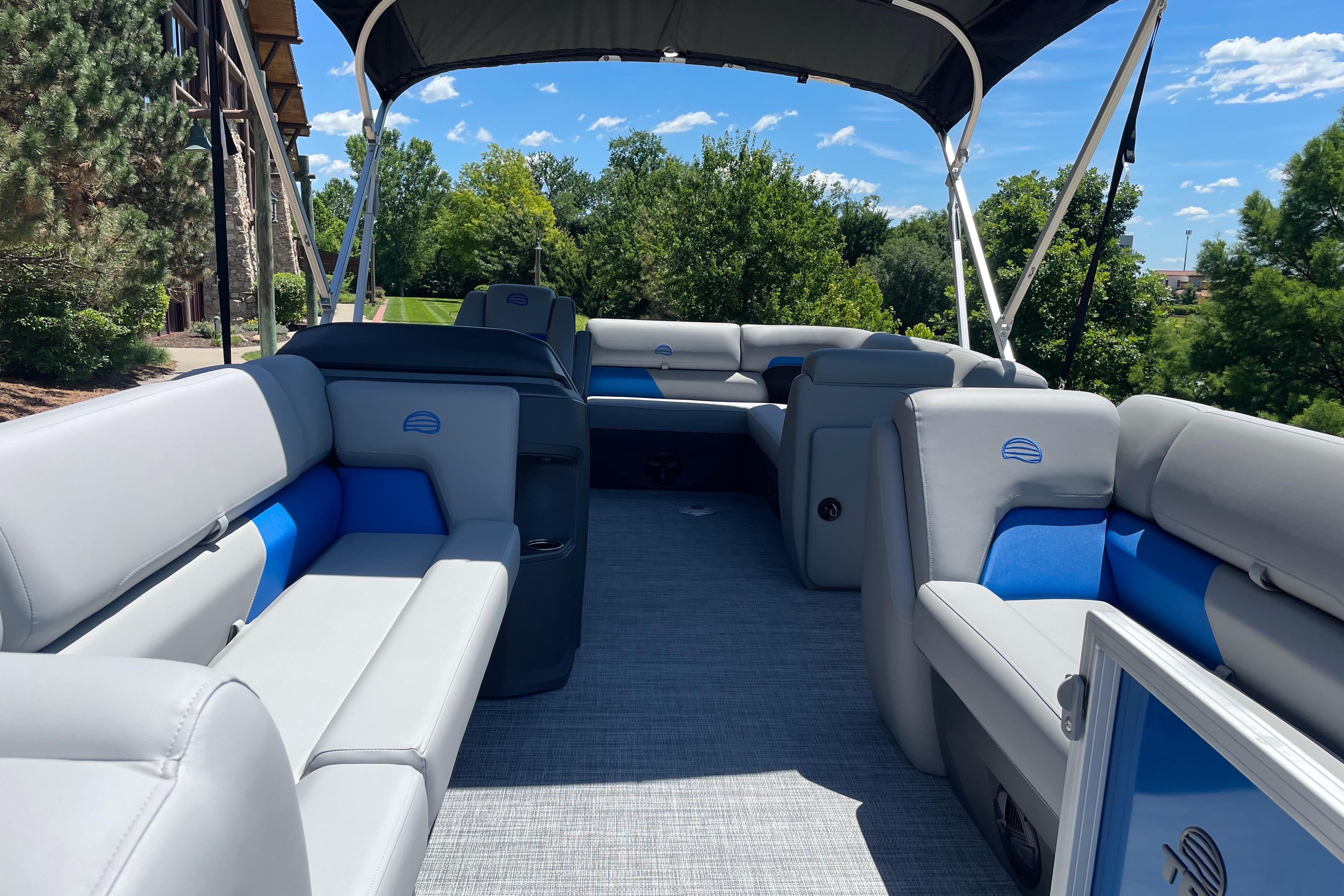2026 Sun Tracker Party Barge 20 DLX pontoon boat with spacious seating and canopy.