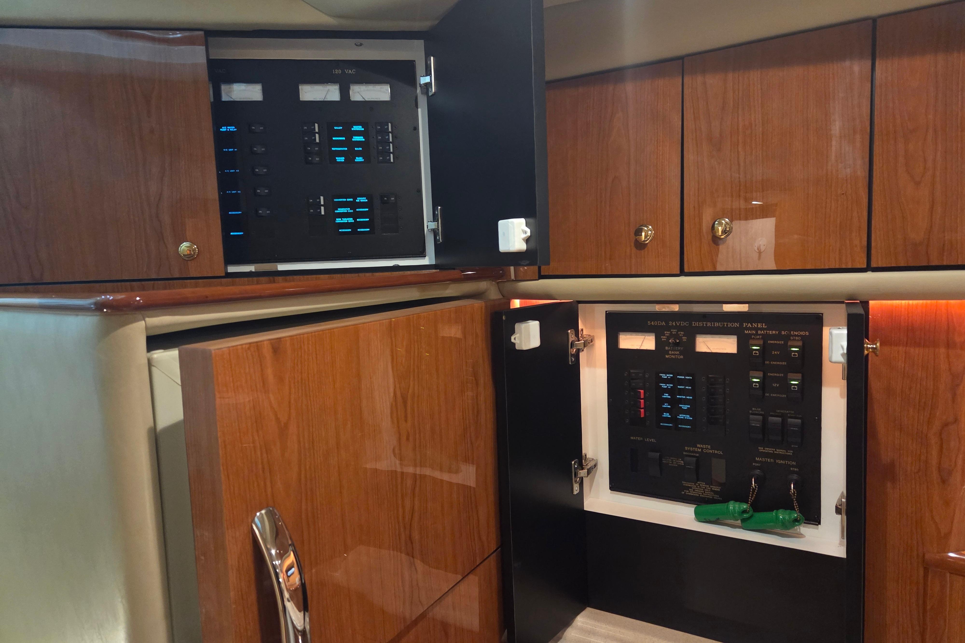Electrical control panels inside a 2000 Sea Ray Sundancer 540 yacht cabin.