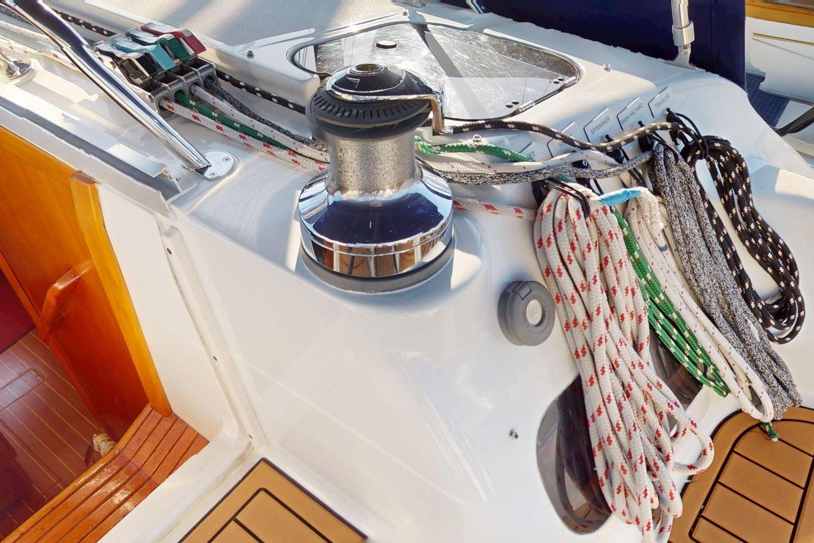 Deck of 1997 Hunter Legend 40.5 sailboat with winch and ropes.