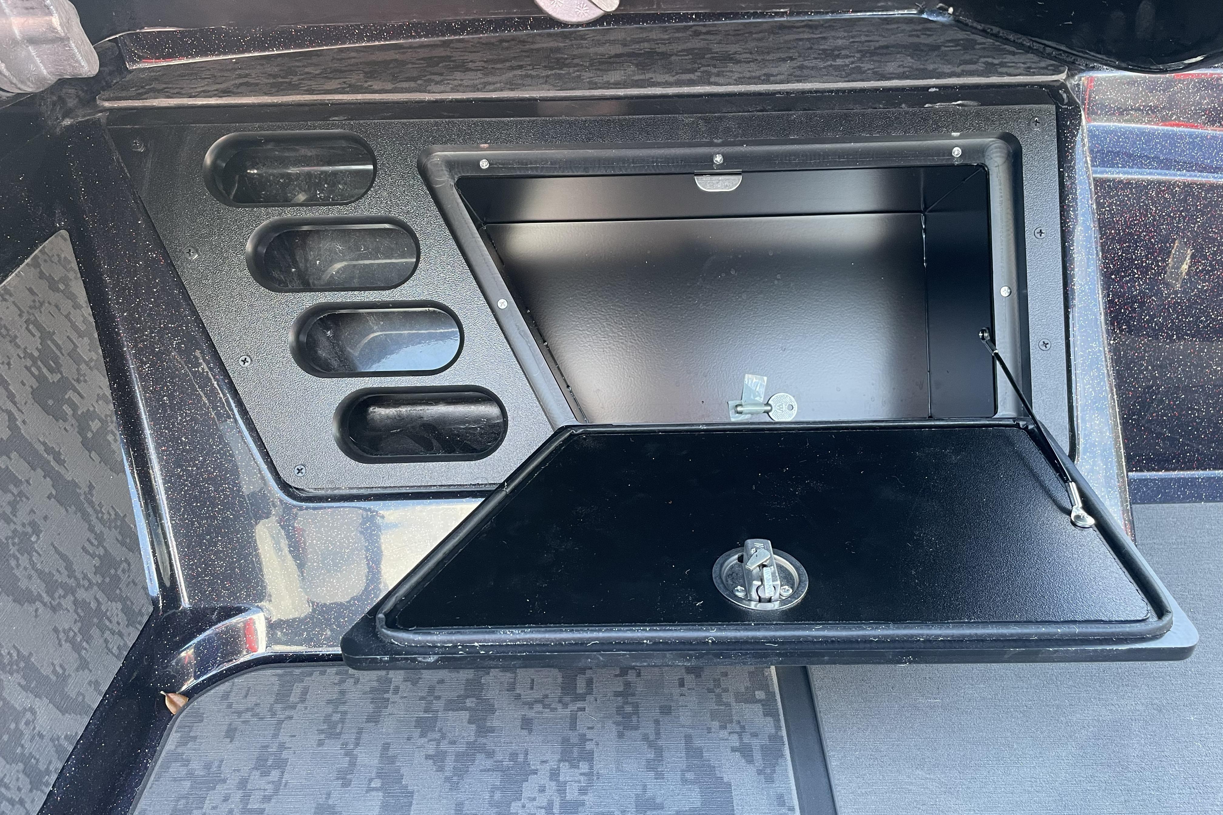 2026 Nitro Z19 XL boat storage compartment with open hatch and organized slots.