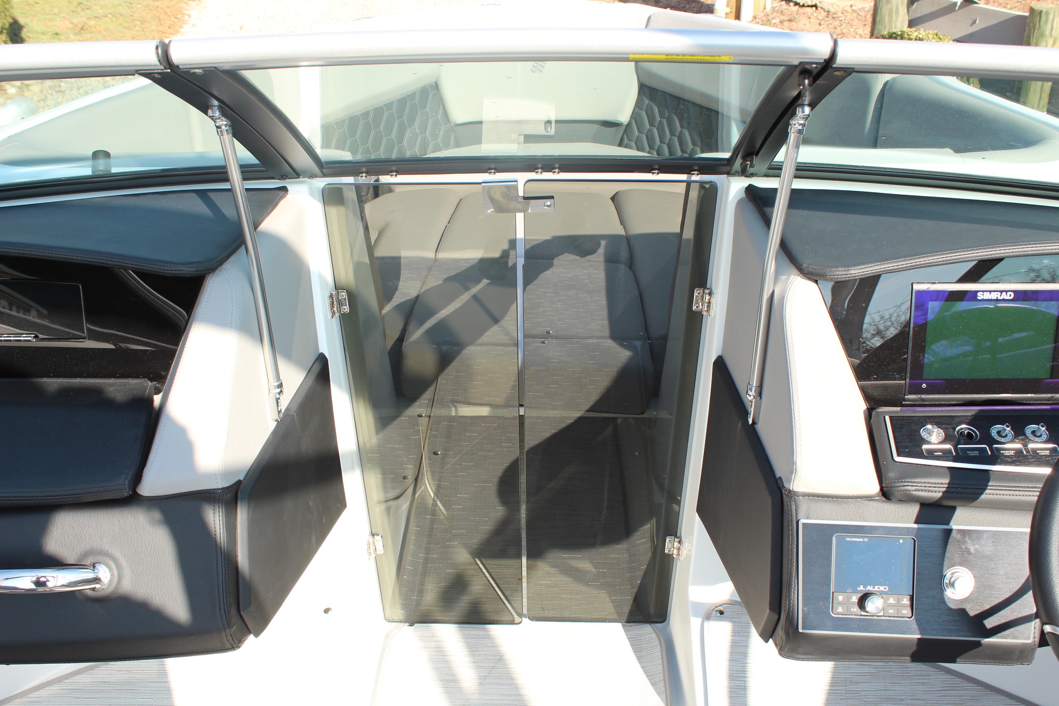 Interior view of 2026 Four Winns H4 boat cockpit with modern controls and seating.