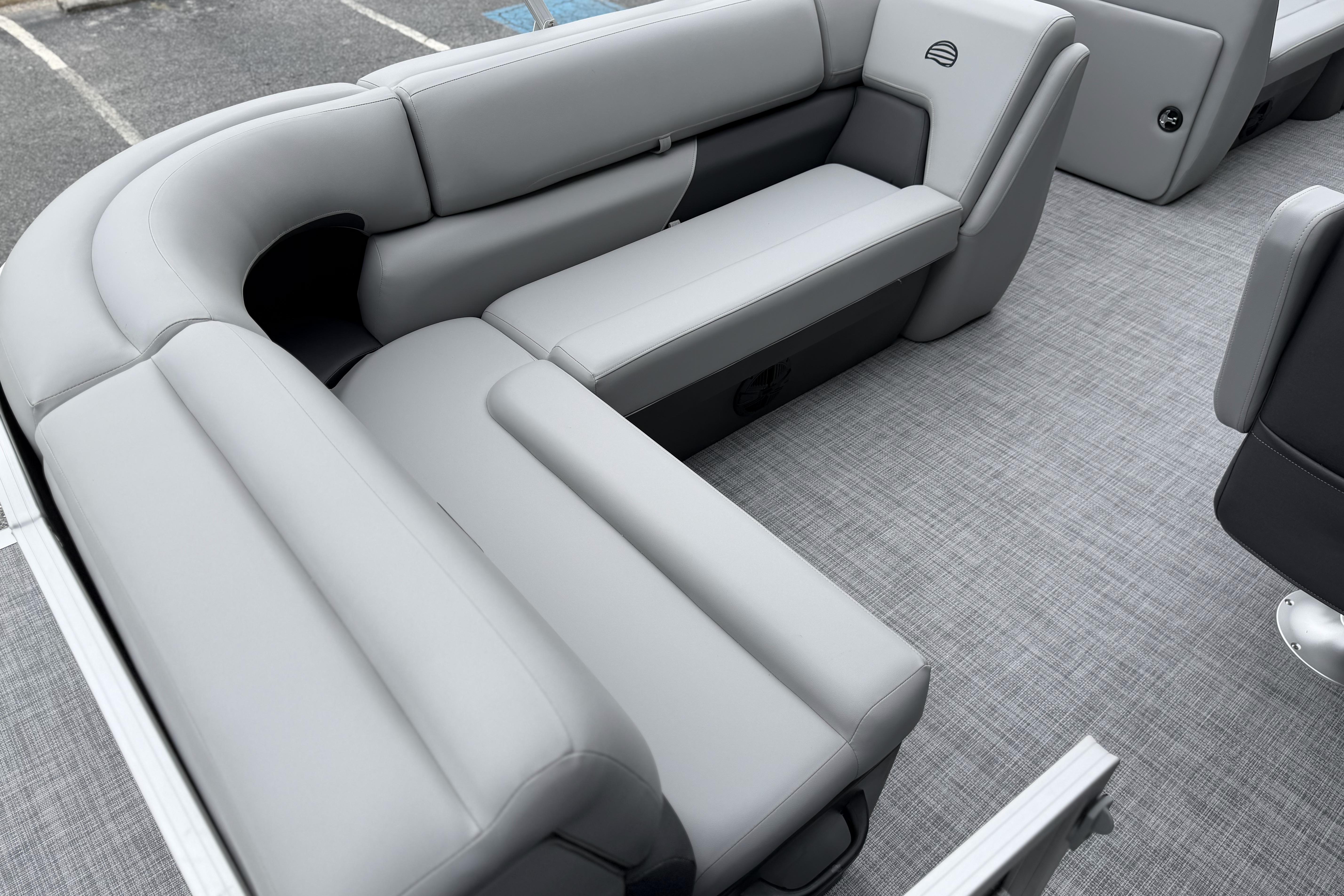 2026 Sun Tracker Party Barge 20 DLX interior with gray seating and flooring.