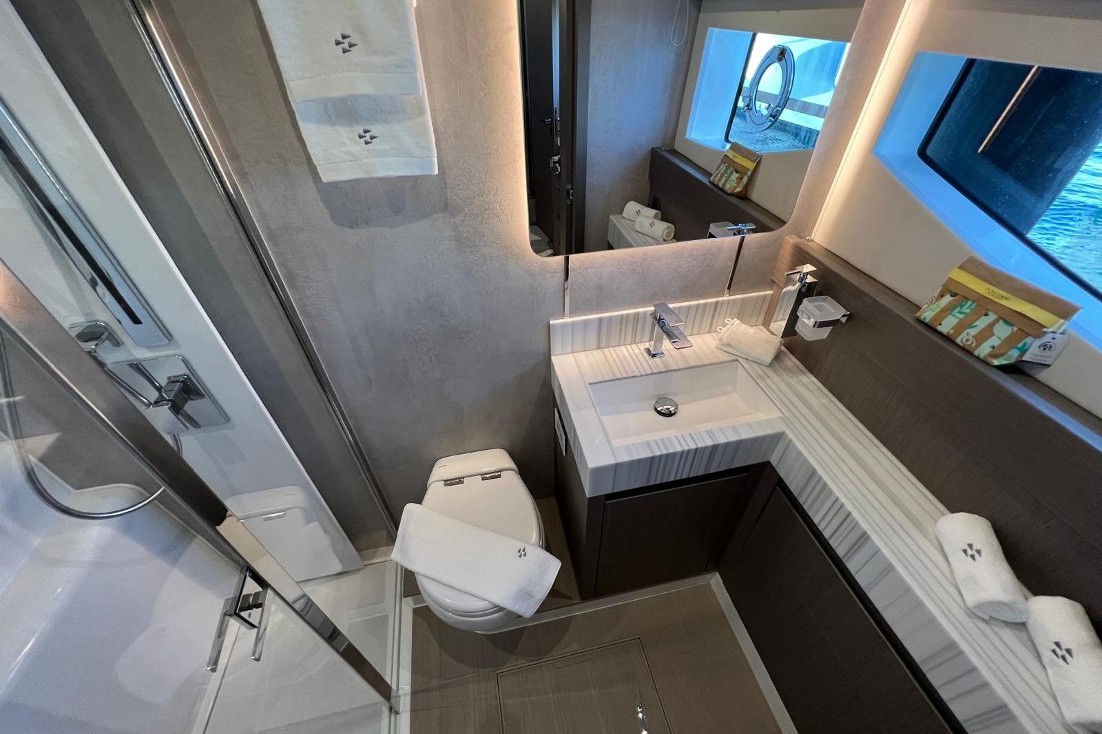 Luxurious bathroom in 2024 Prestige M8 yacht, featuring modern fixtures and elegant design.