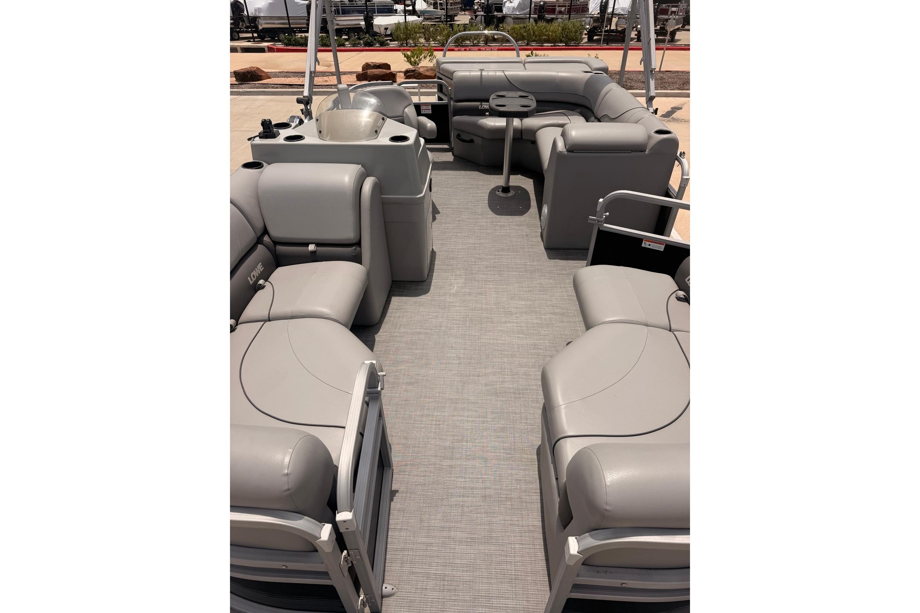 2021 Lowe SS 210 pontoon boat interior with gray seating and spacious layout.