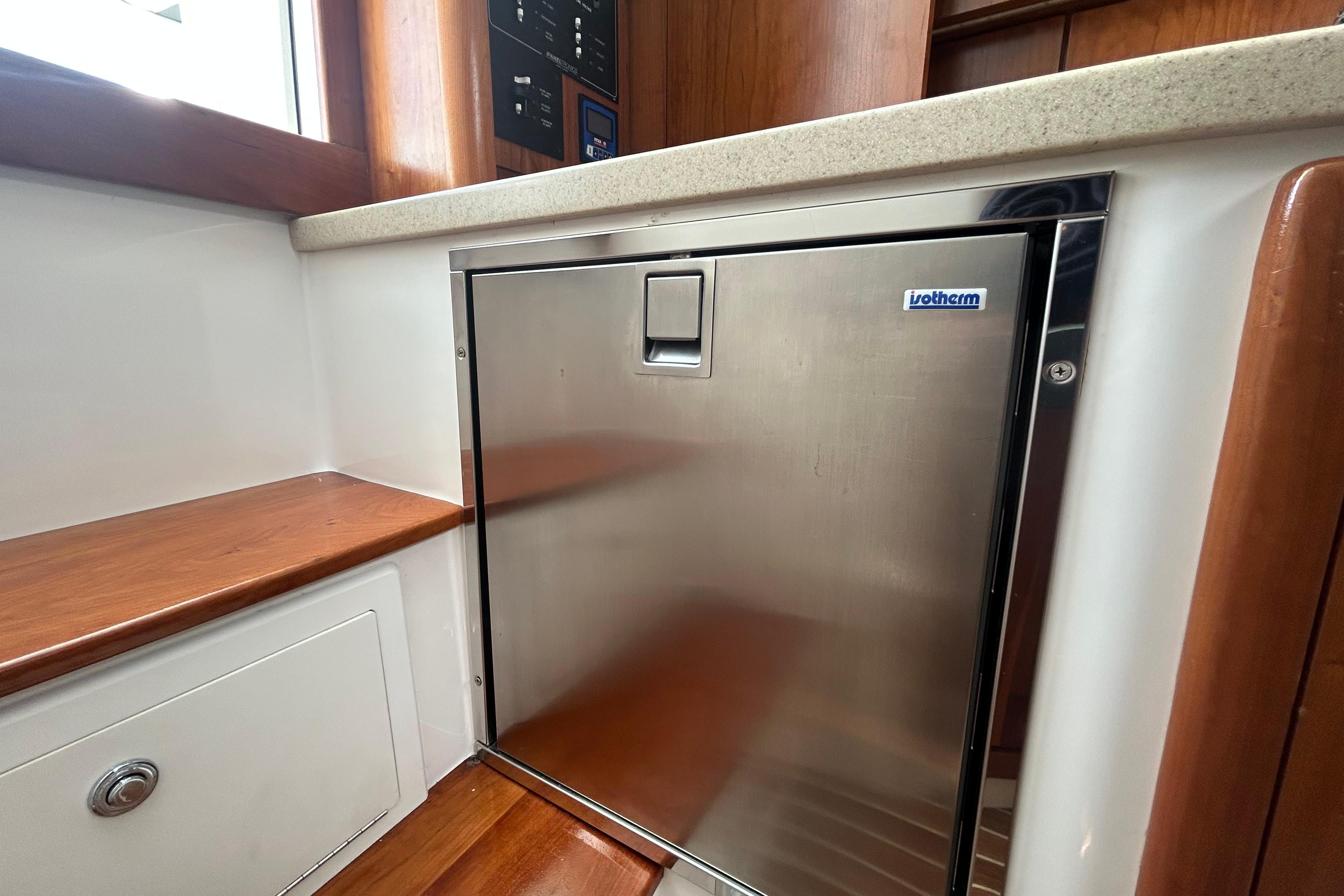 Stainless steel fridge in 2018 Albemarle 29 Express boat interior.
