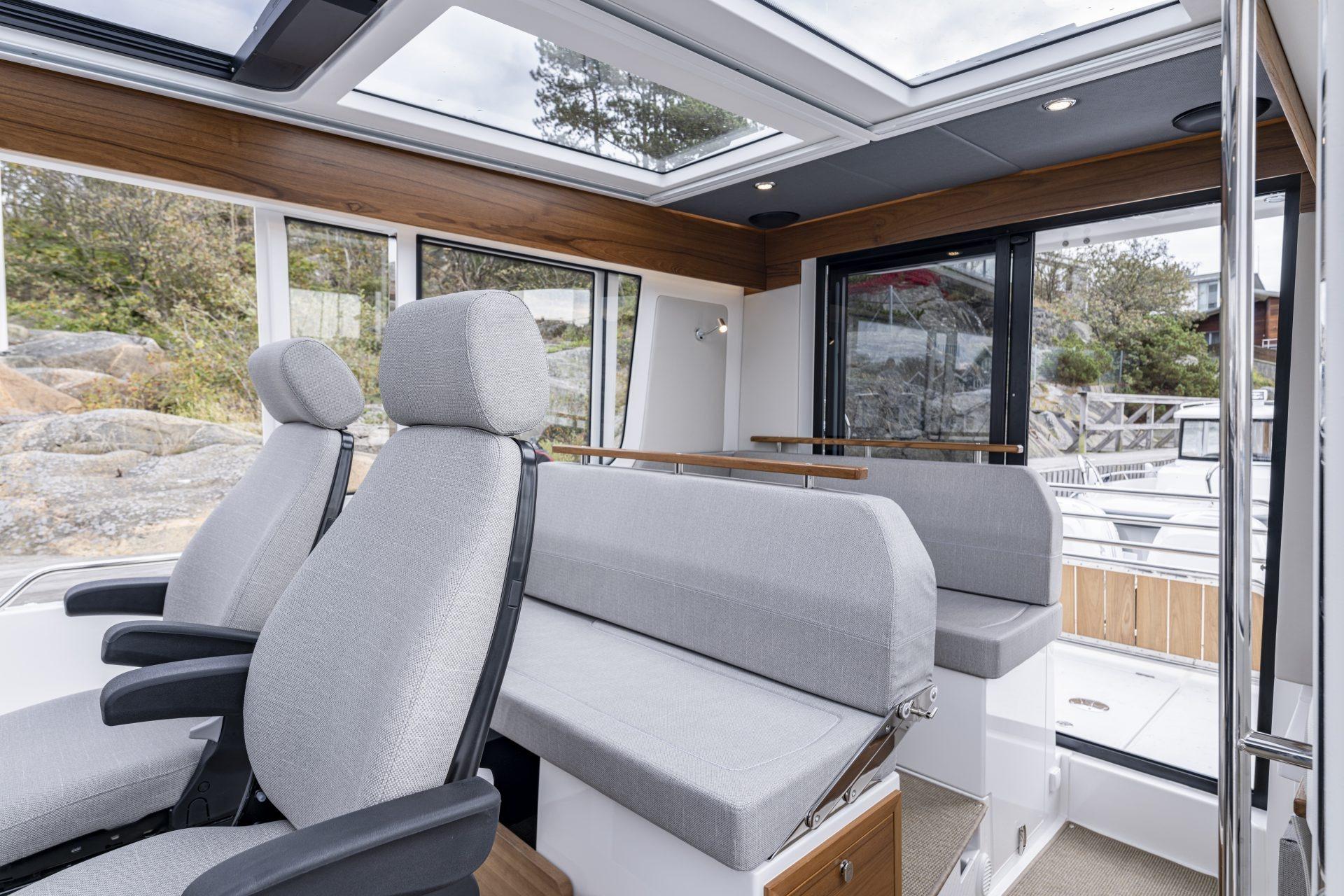 Interior of Nimbus Commuter 11 boat, 2025 model, featuring modern seating.