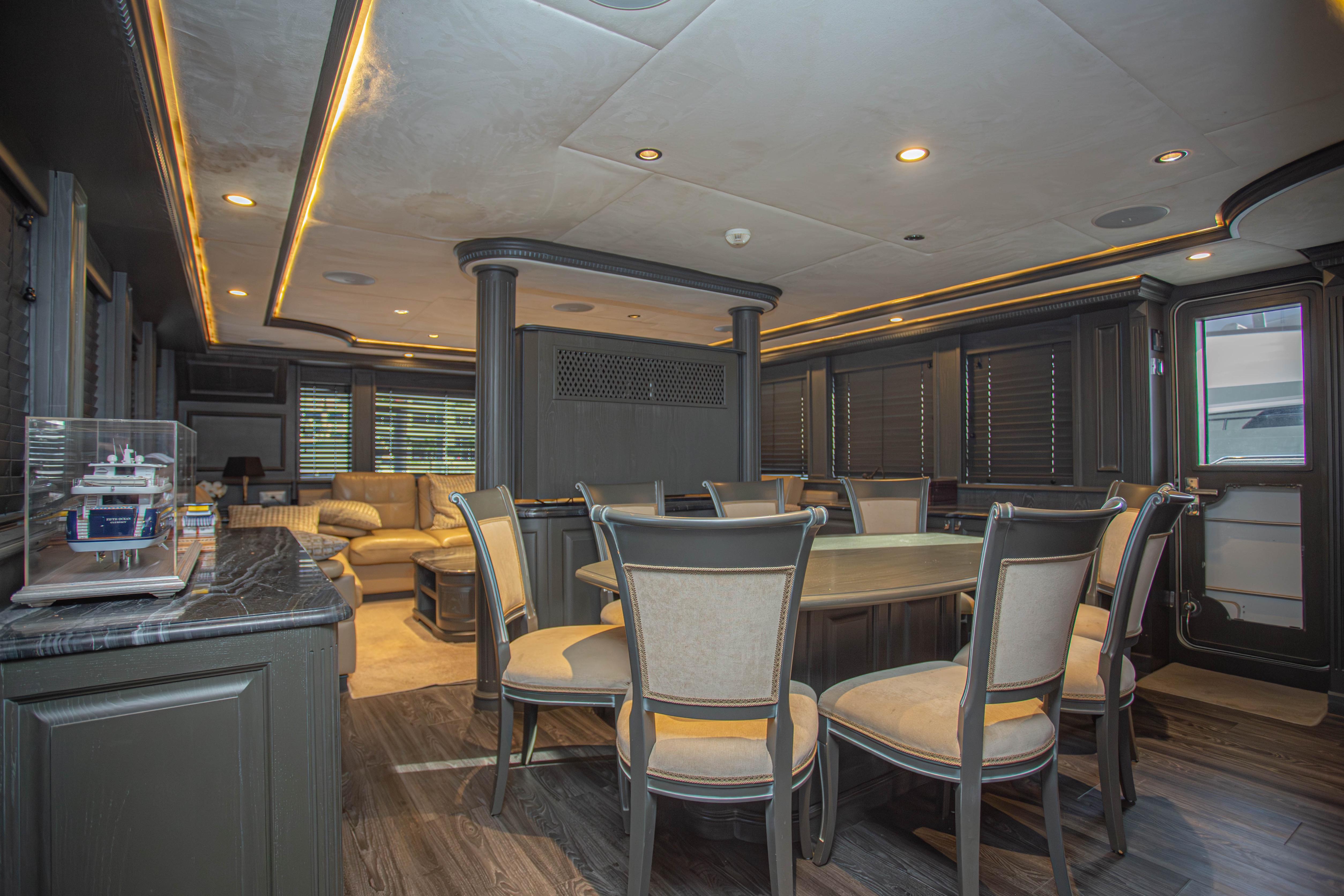 Luxurious interior of 2014 Fifth Ocean Yachts 24m Explorer Yacht with elegant dining area.