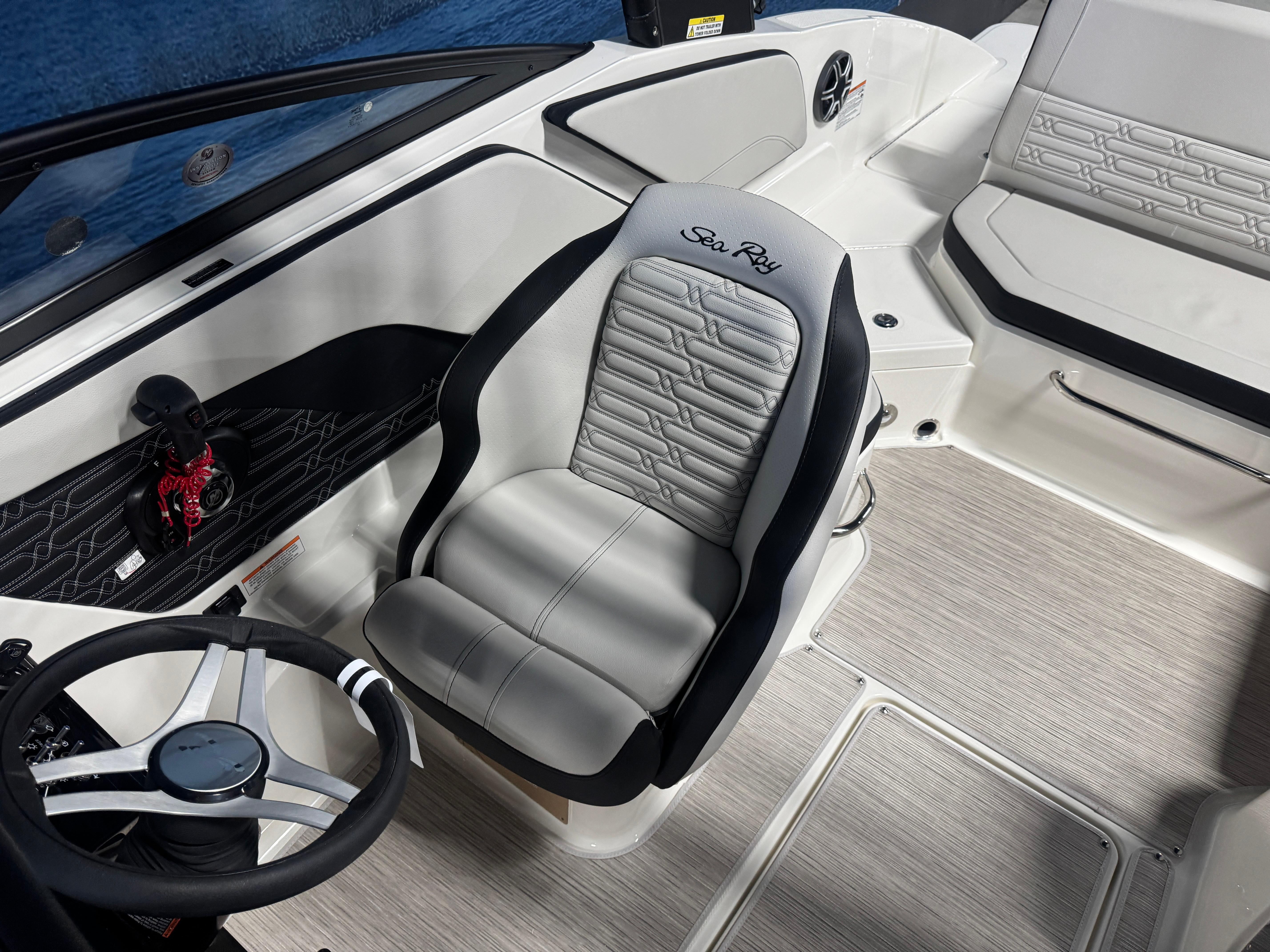 2026 Sea Ray SPX 210 boat interior with sleek steering and comfortable seating.